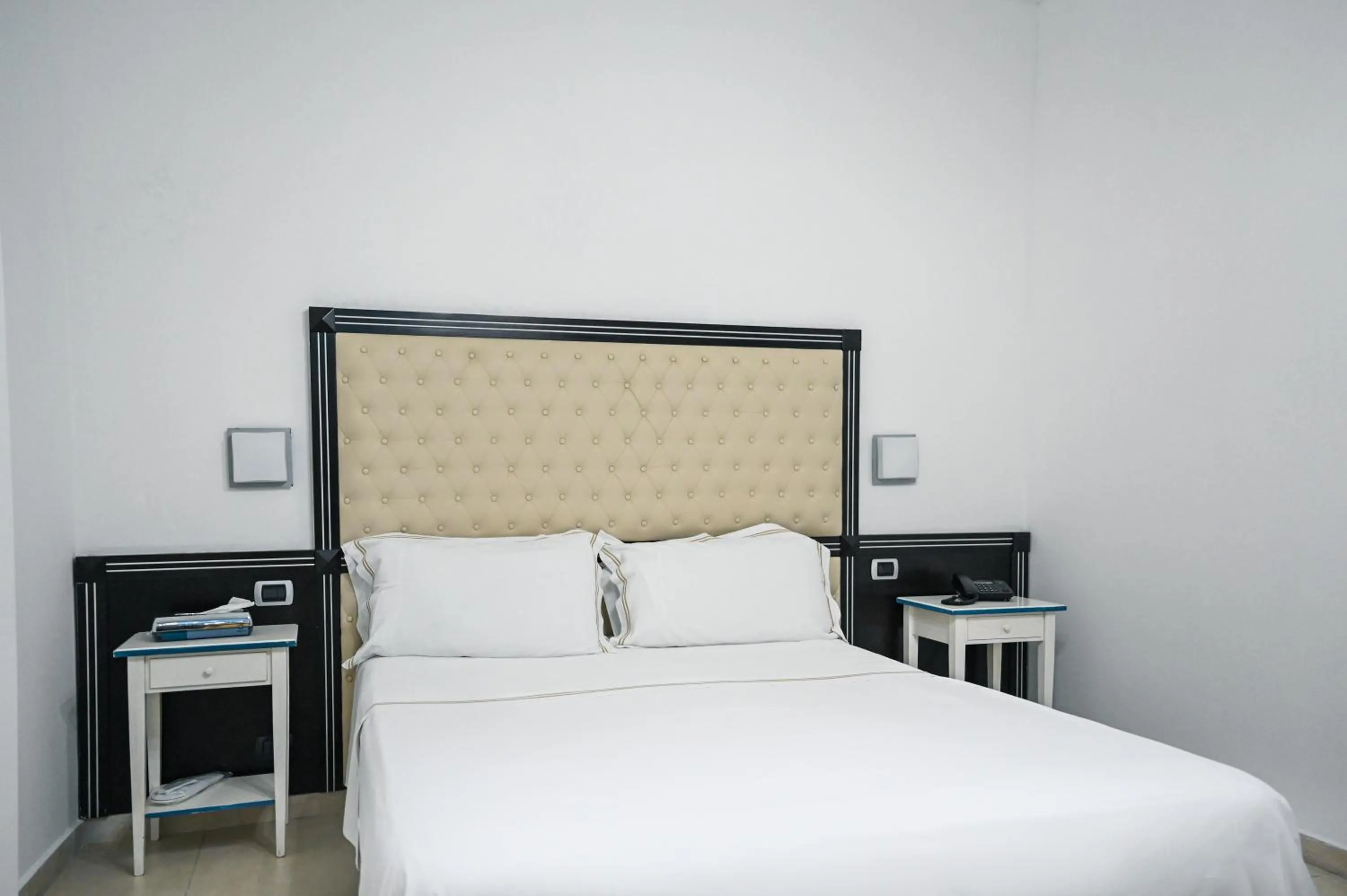 Bed in Hotel Palazzo Krataiis