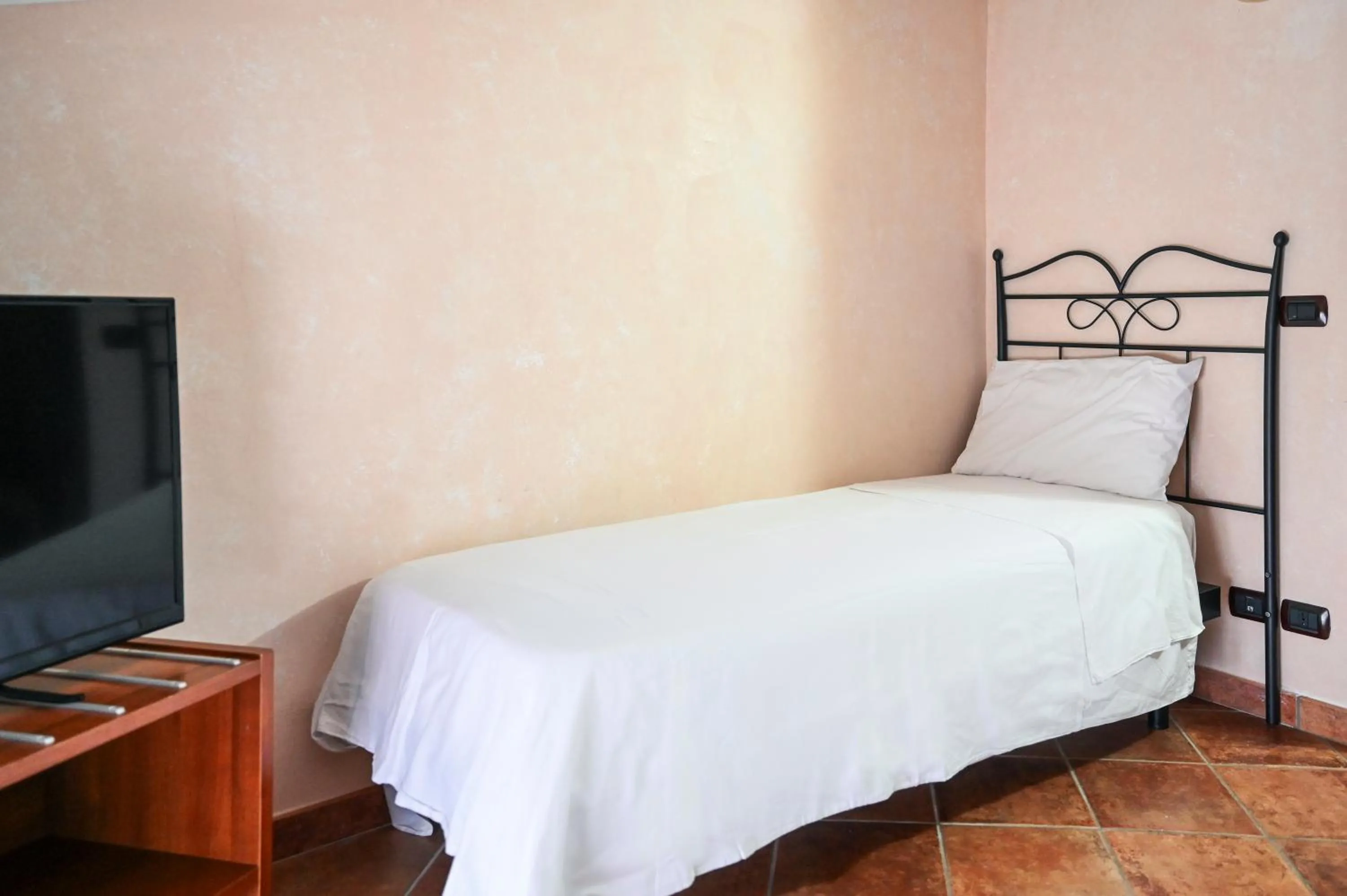 Bed in Hotel Palazzo Krataiis