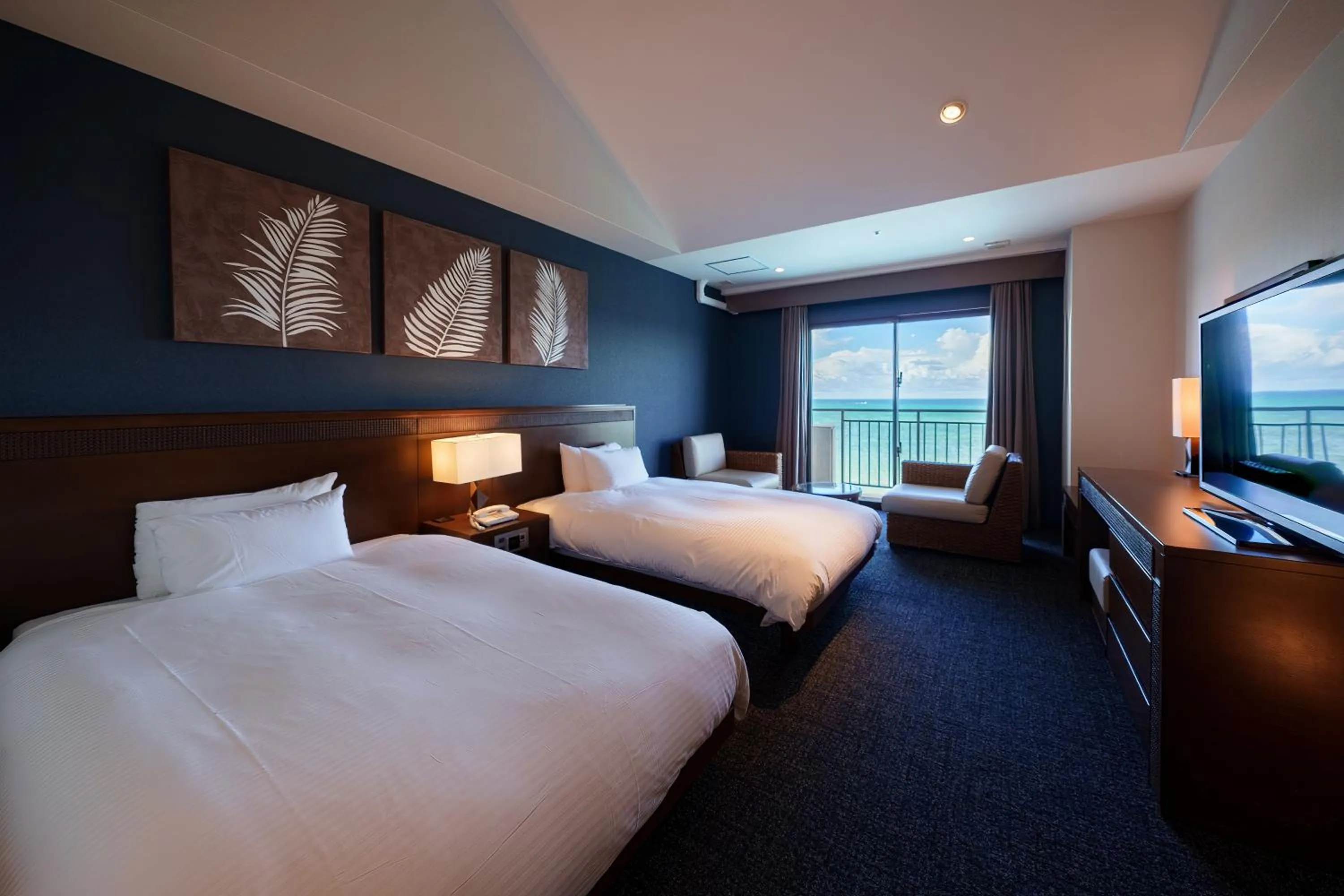 Bed in GRANDVRIORESORT ISHIGAKIJIMA Ocean's Wing & Villa Garden