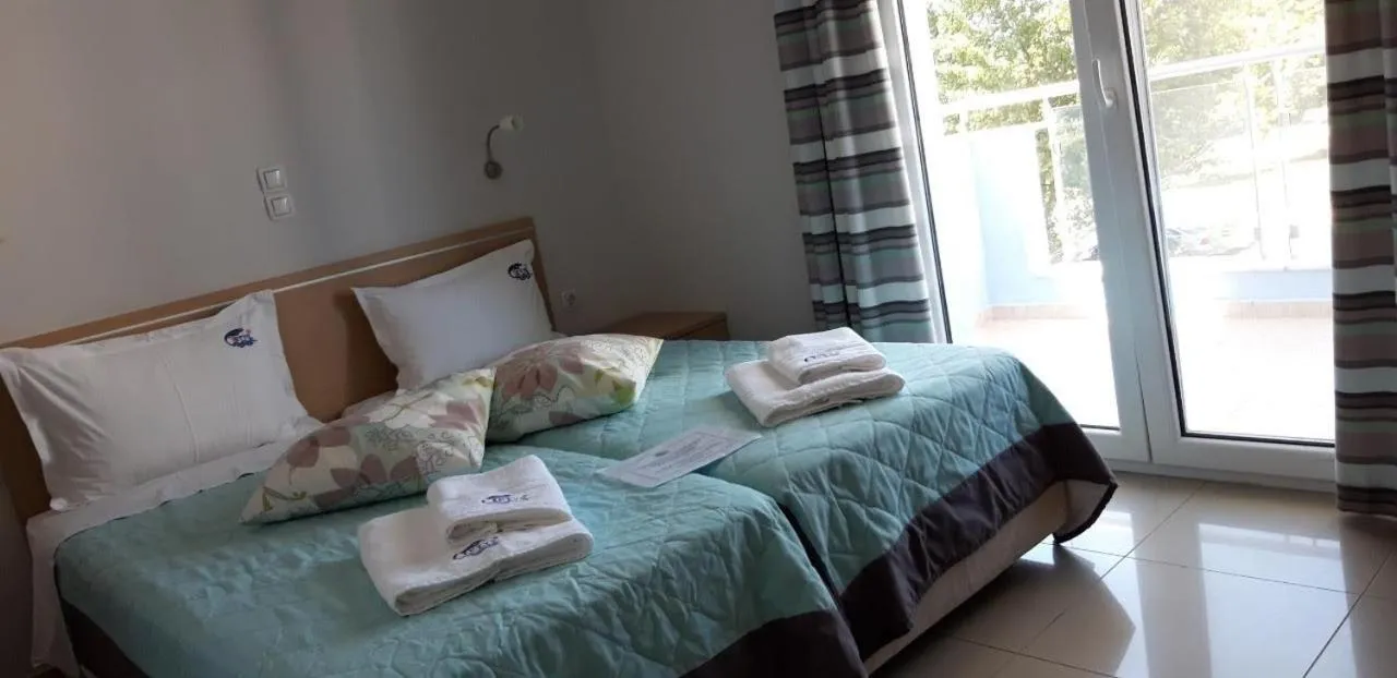 Bed in TETYK Keramoti Hotel Apartments