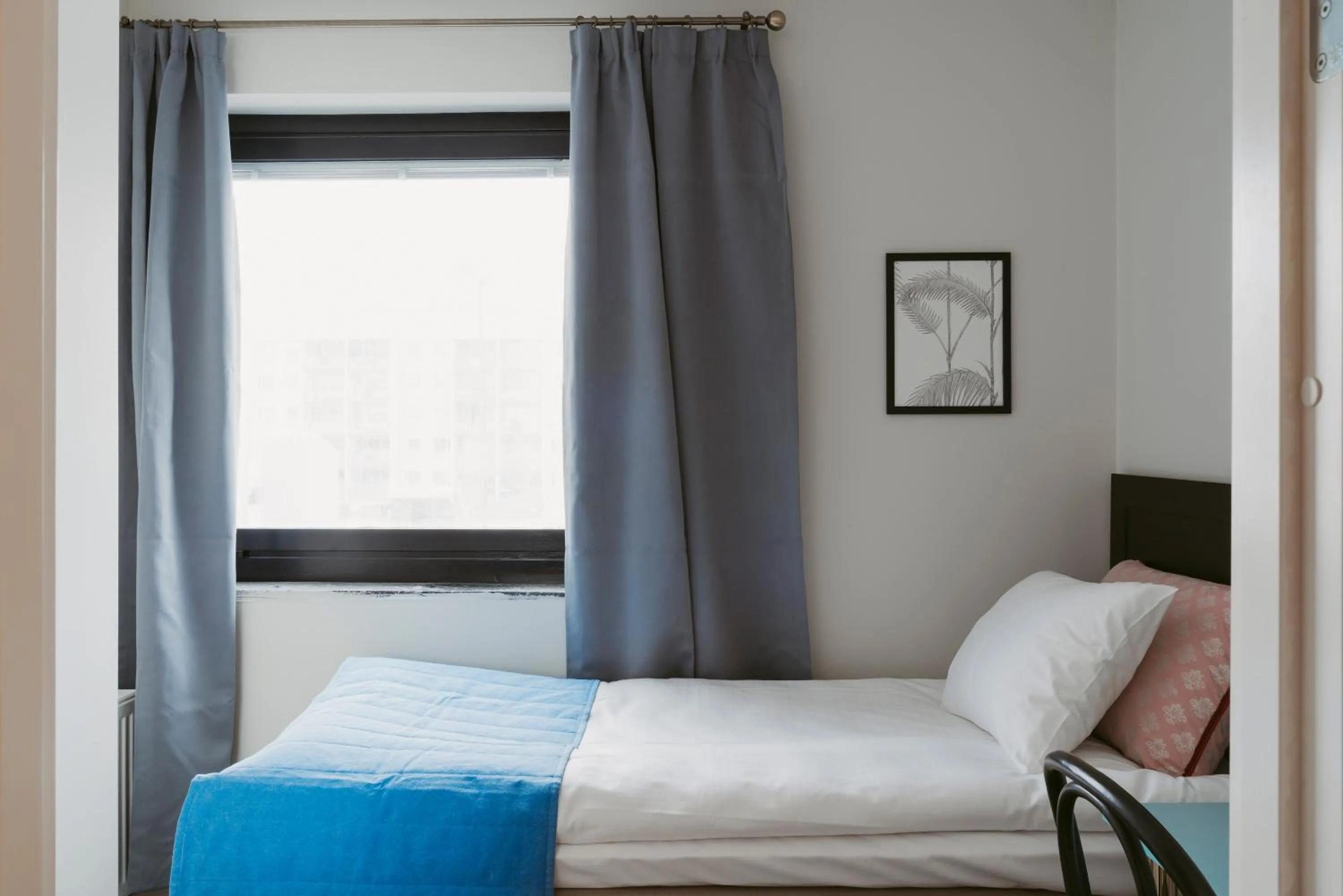 Bed in 2Home Hotel Gävle