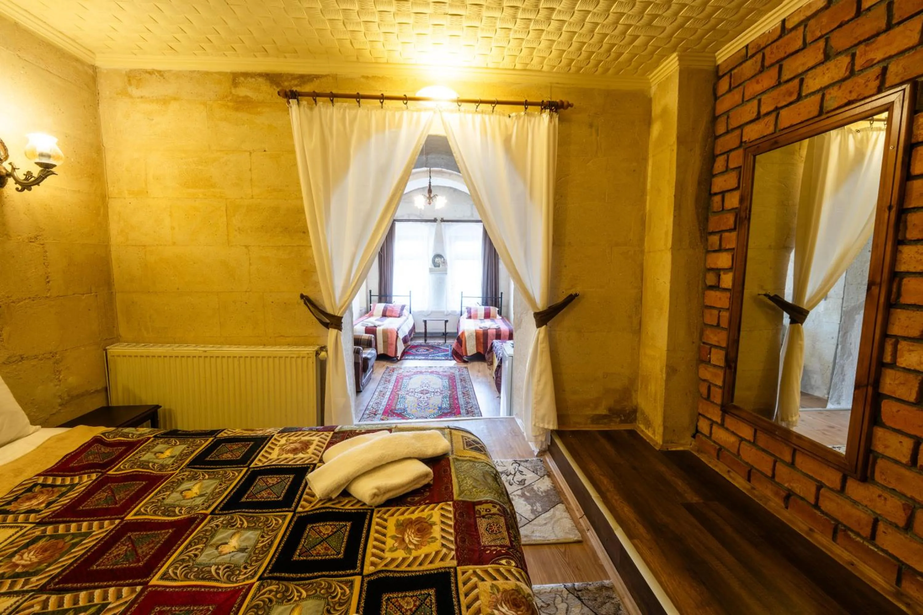 Photo of the whole room, Bed in Asyada Suites Hotel