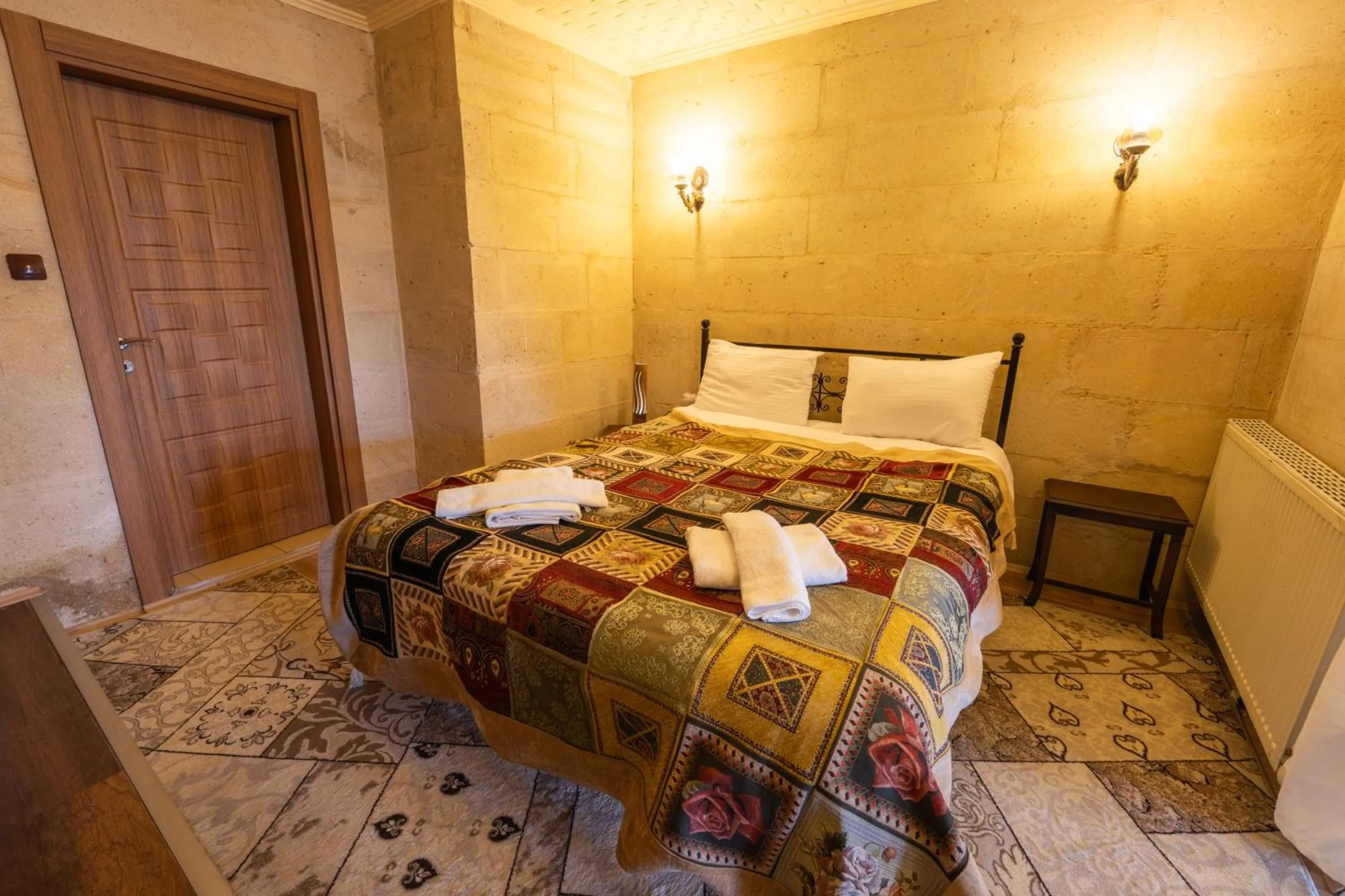 Bed in Asyada Suites Hotel