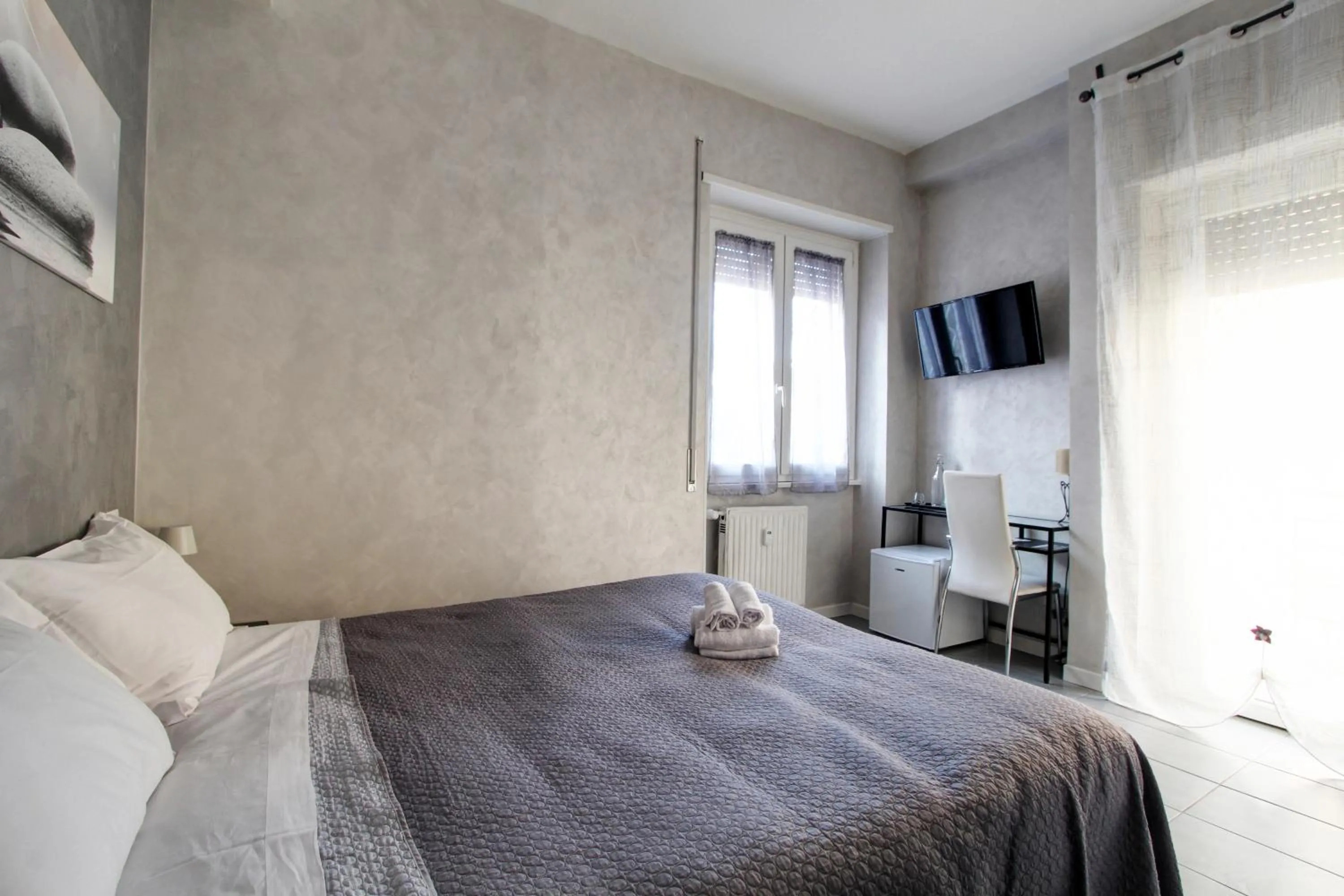 Bed in Vatican Central Suites