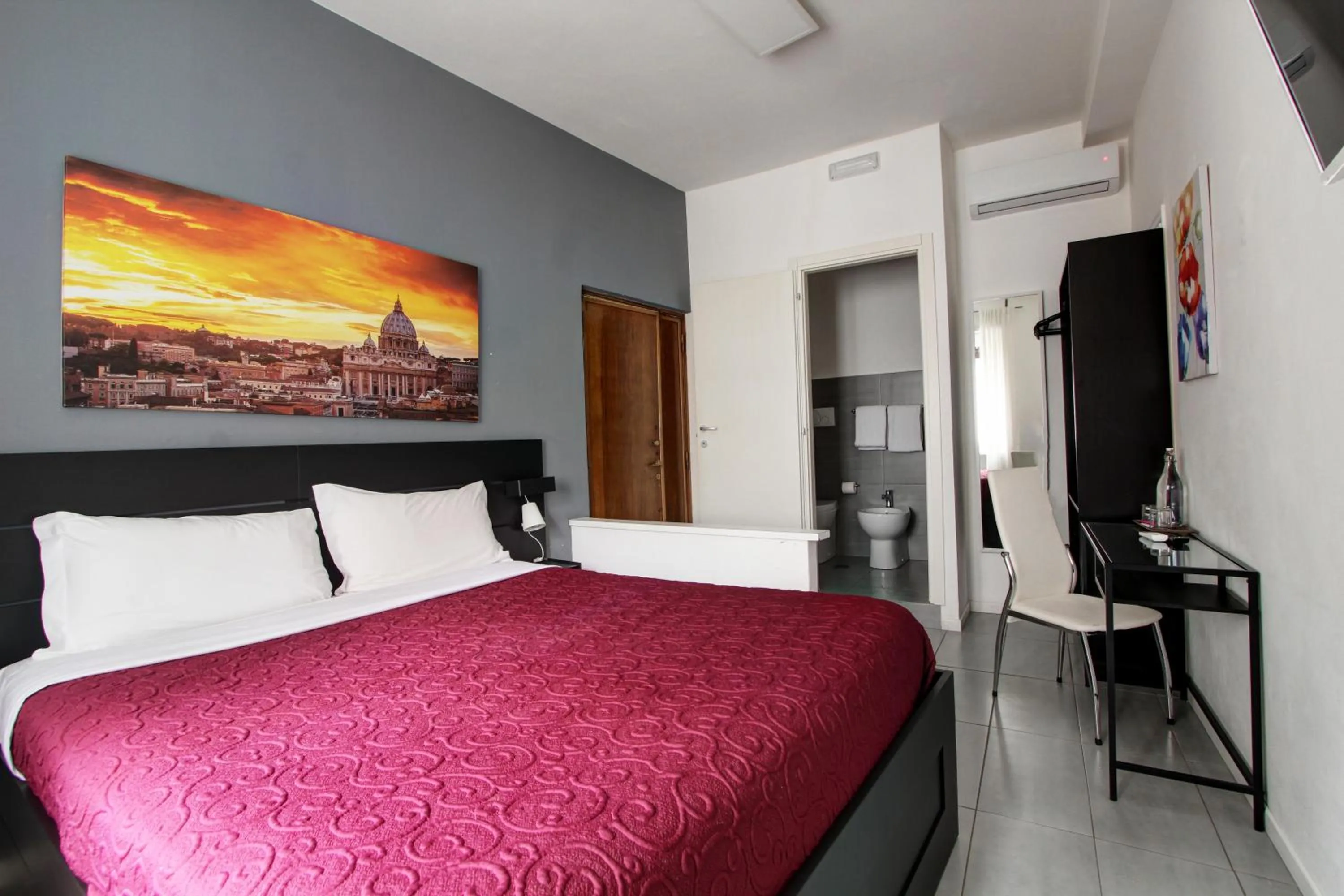 Bed in Vatican Central Suites