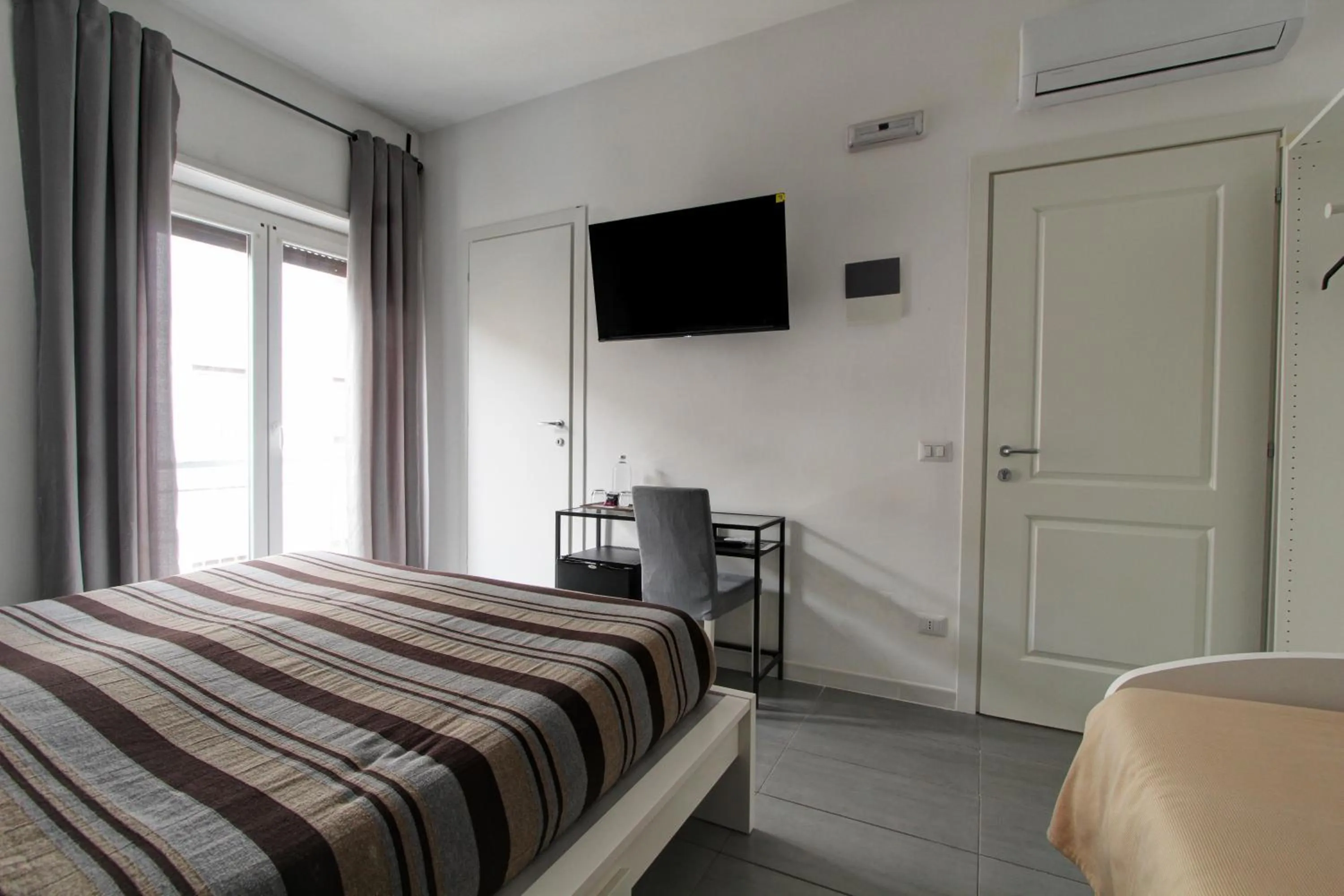 Bed in Vatican Central Suites