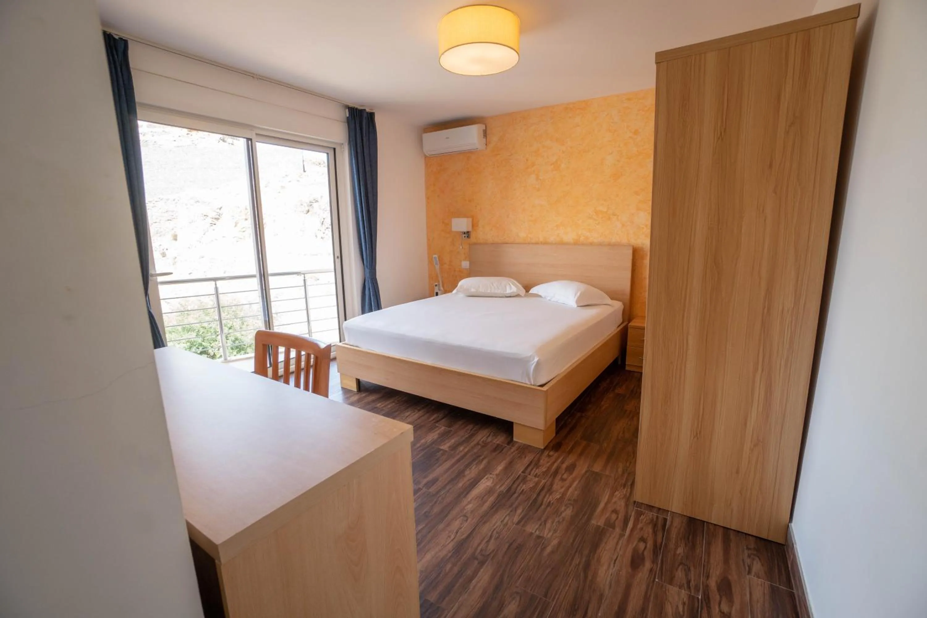 Bed in Blue Marlin Hotel