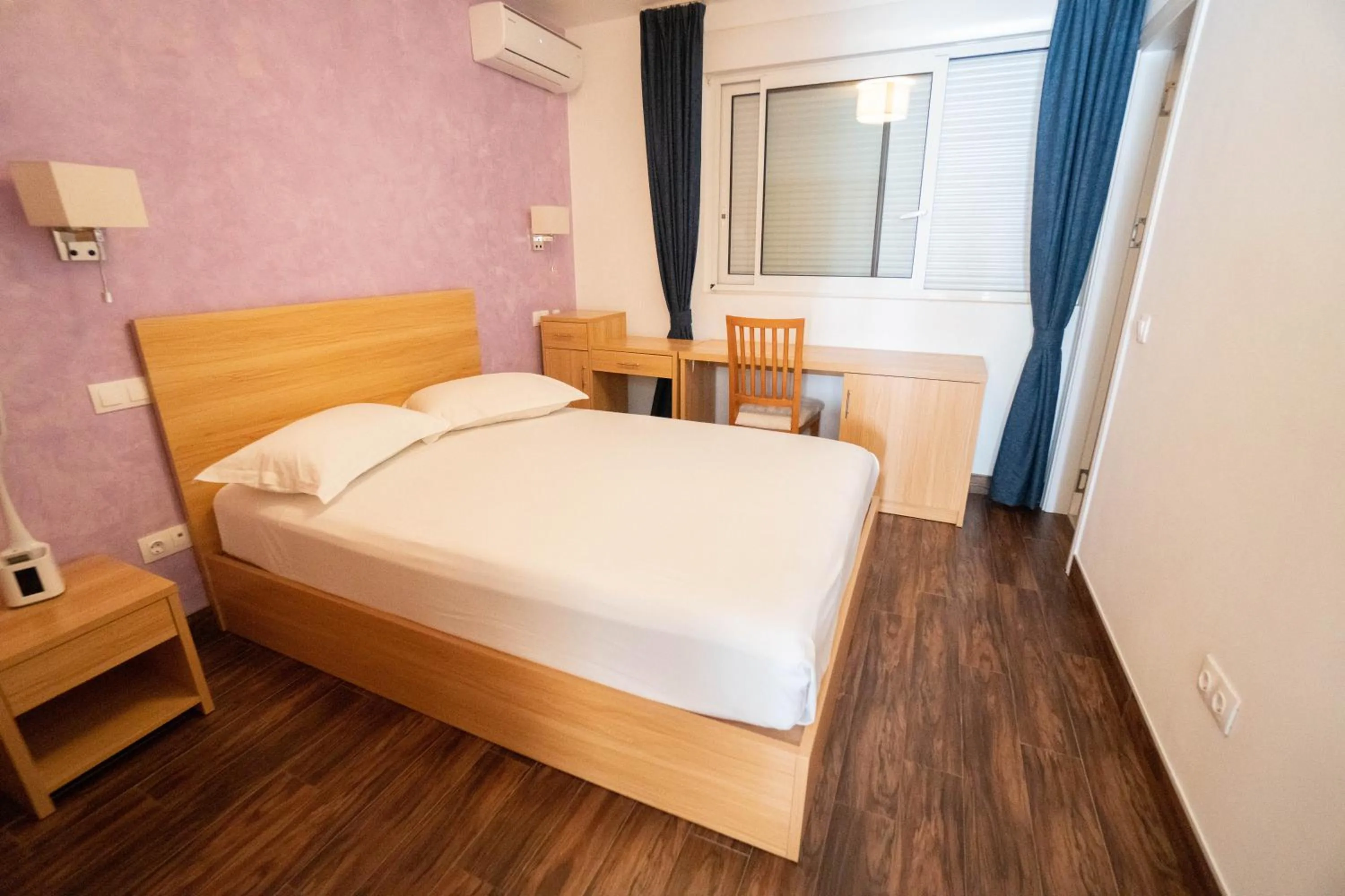 Bed in Blue Marlin Hotel