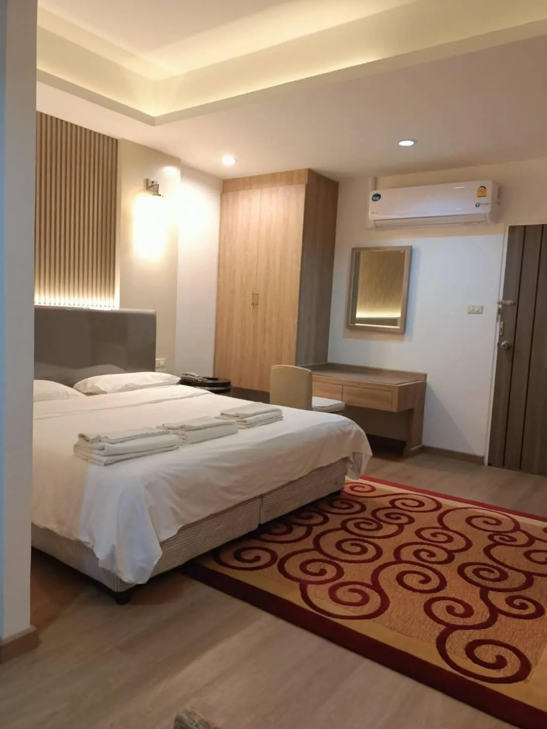 Bed in Royal Garden Home Hotel