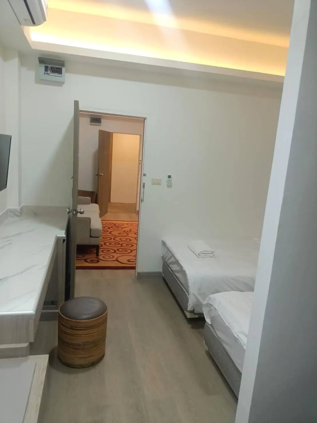 Bed in Royal Garden Home Hotel