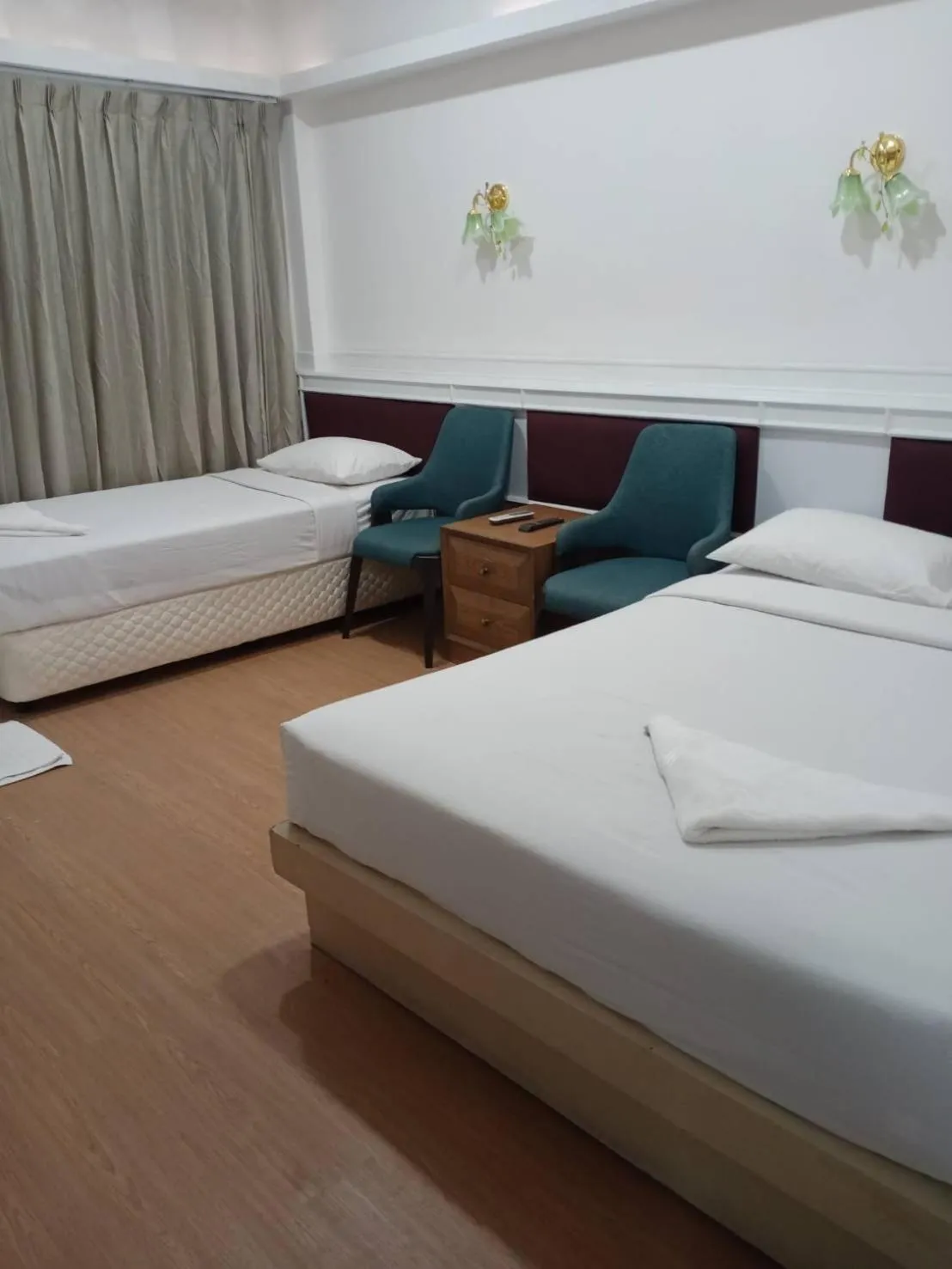 Bed in Royal Garden Home Hotel