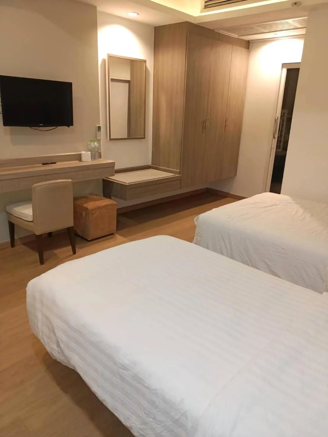 Bed in Royal Garden Home Hotel