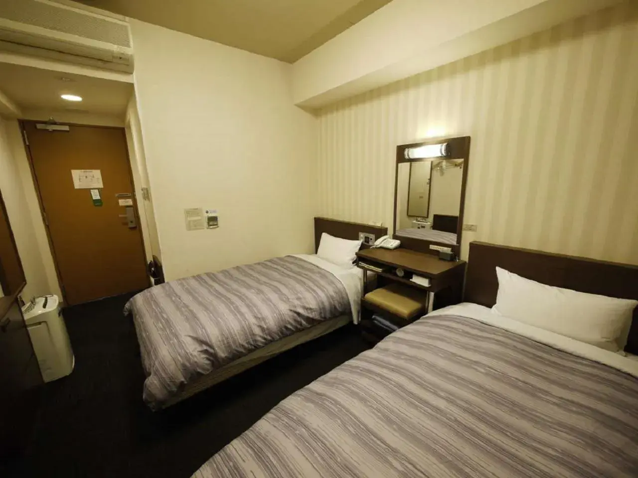 Bed in Hotel Route-Inn Yokohama Bashamichi Bed in Hotel Route-Inn Yokohama Bashamichi