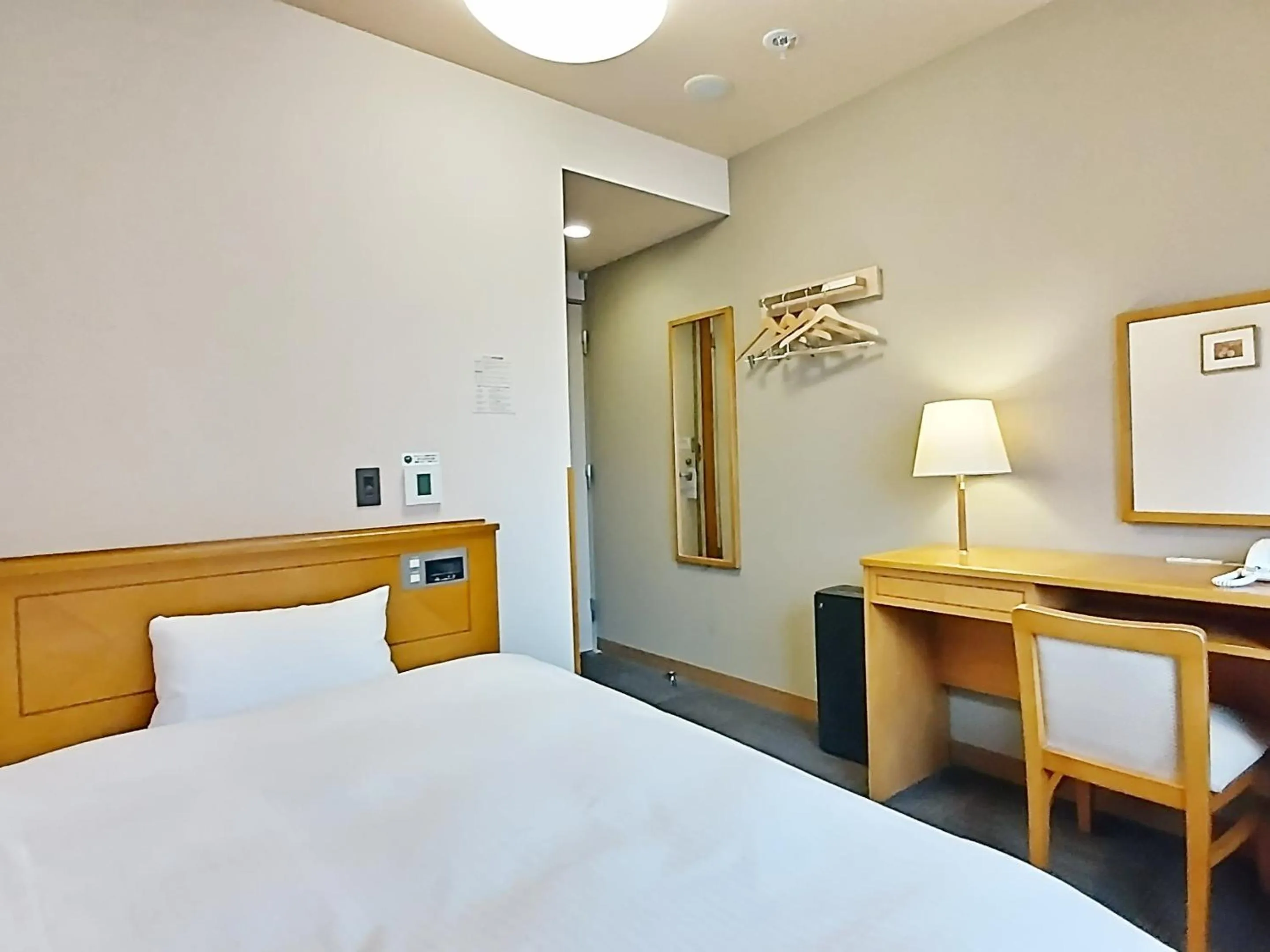 Photo of the whole room, Bed in Hotel Route-Inn Aomori Ekimae