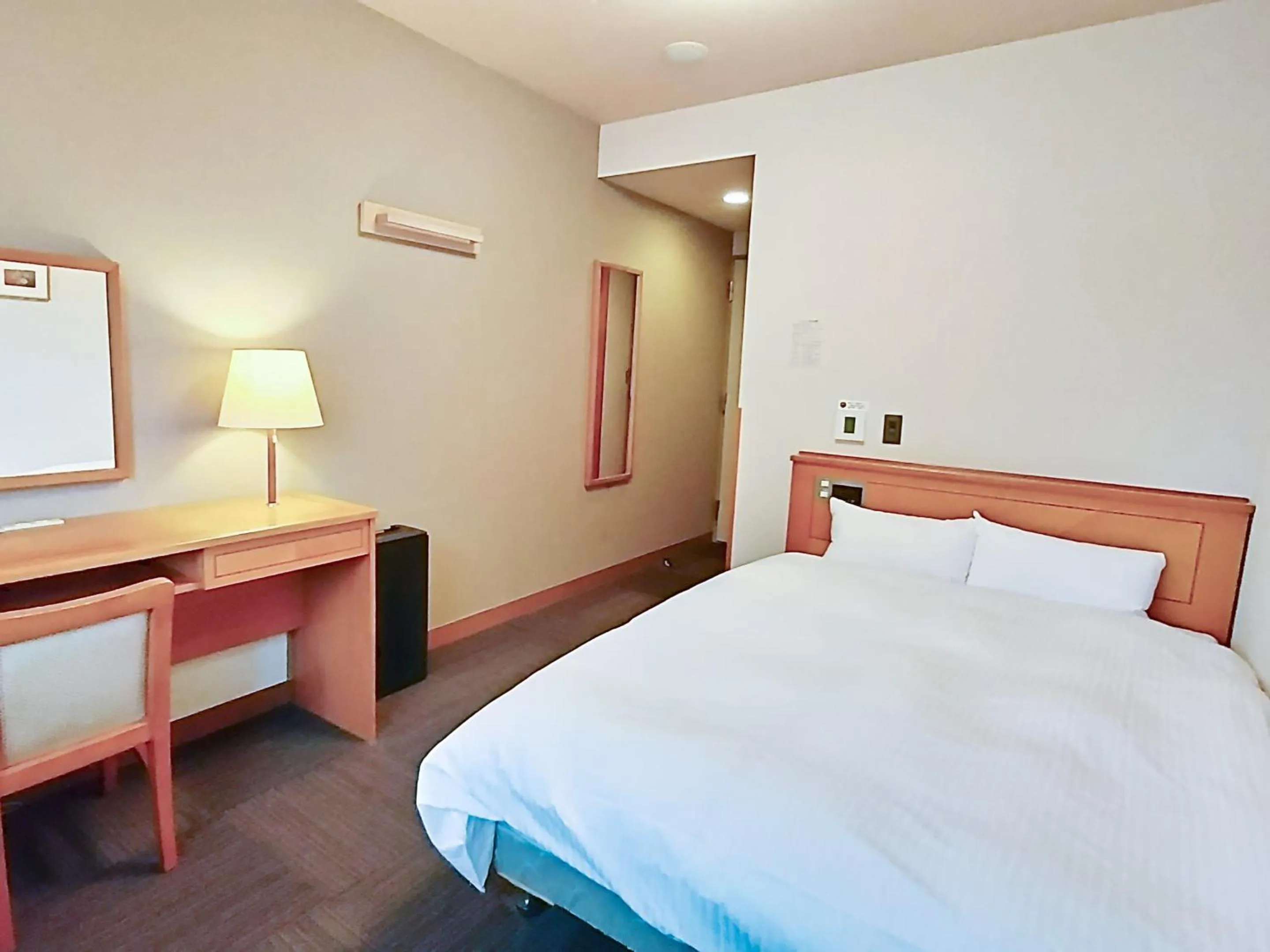 Photo of the whole room, Bed in Hotel Route-Inn Aomori Ekimae
