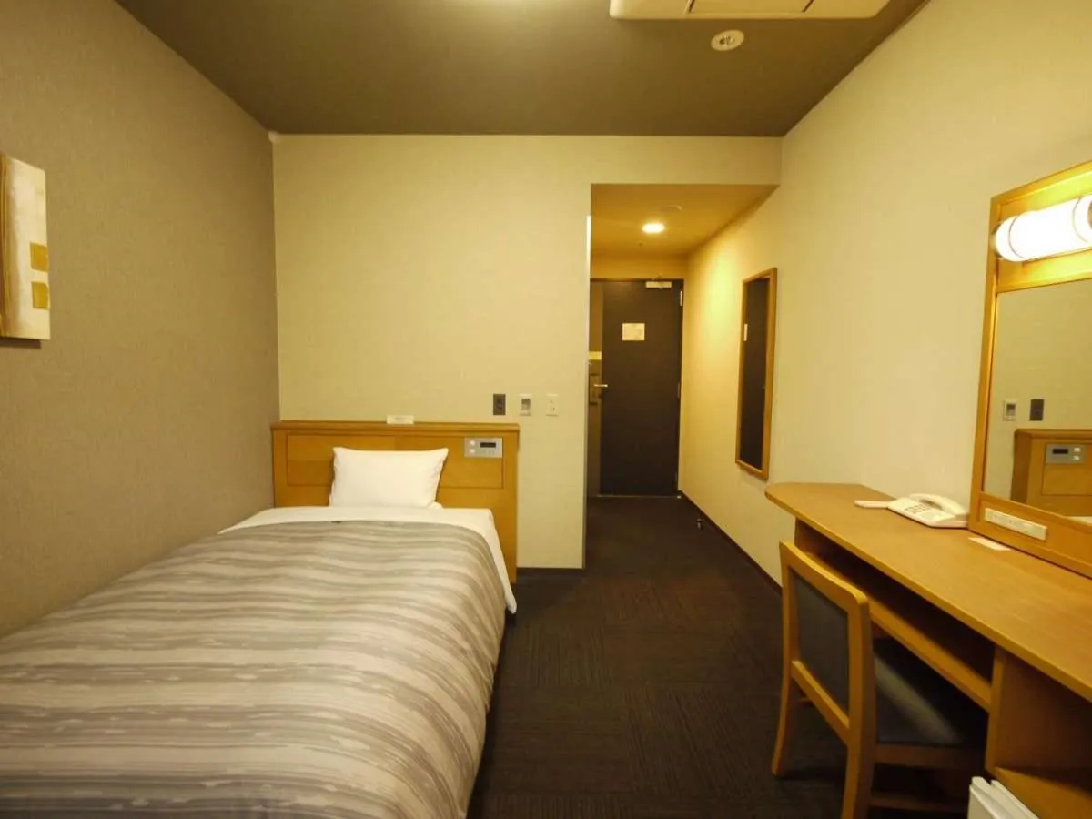 Photo of the whole room, Bed in Hotel Route-Inn Osaka Honmachi