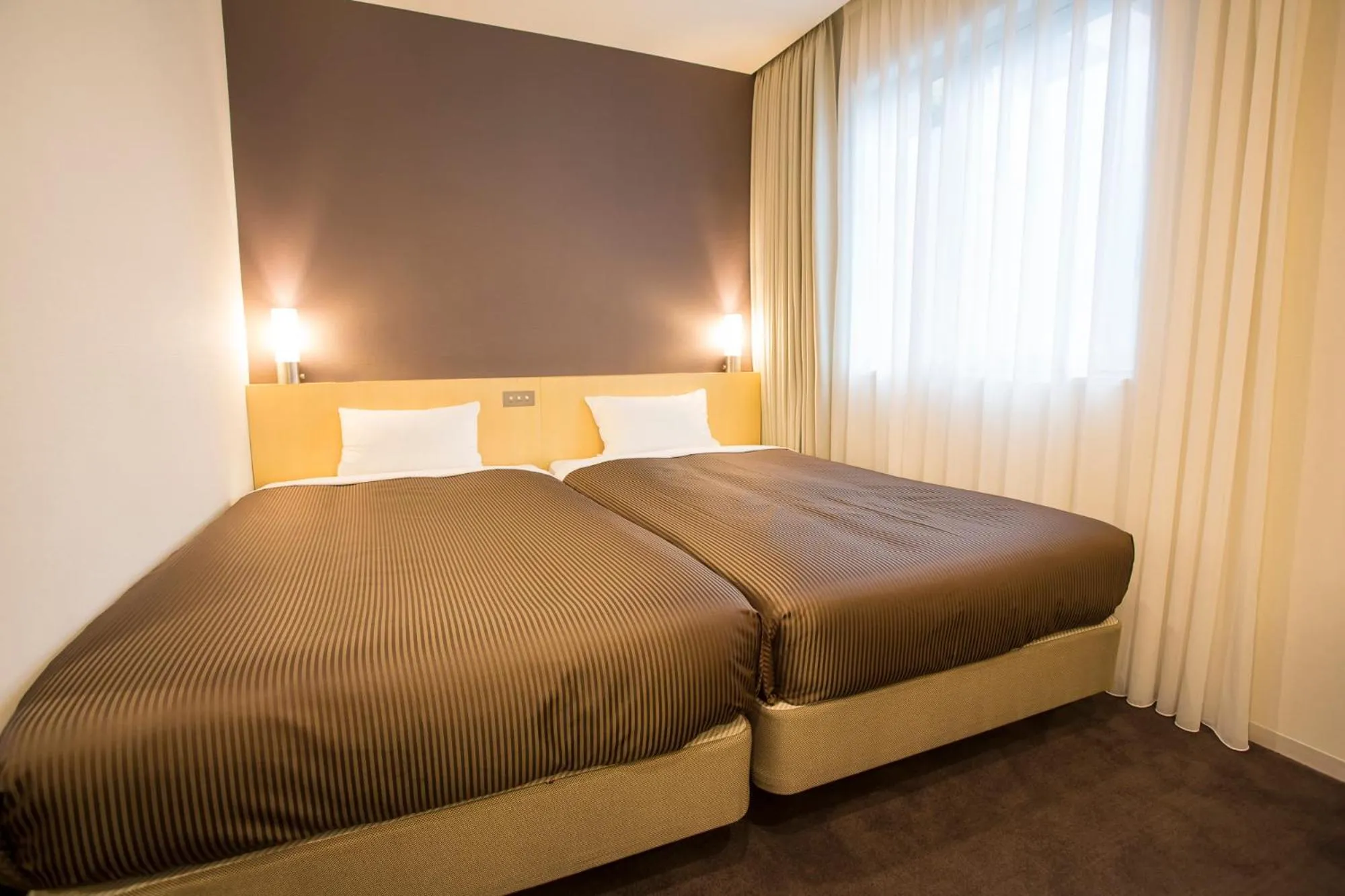 Bed in Hotel Asia Center of Japan