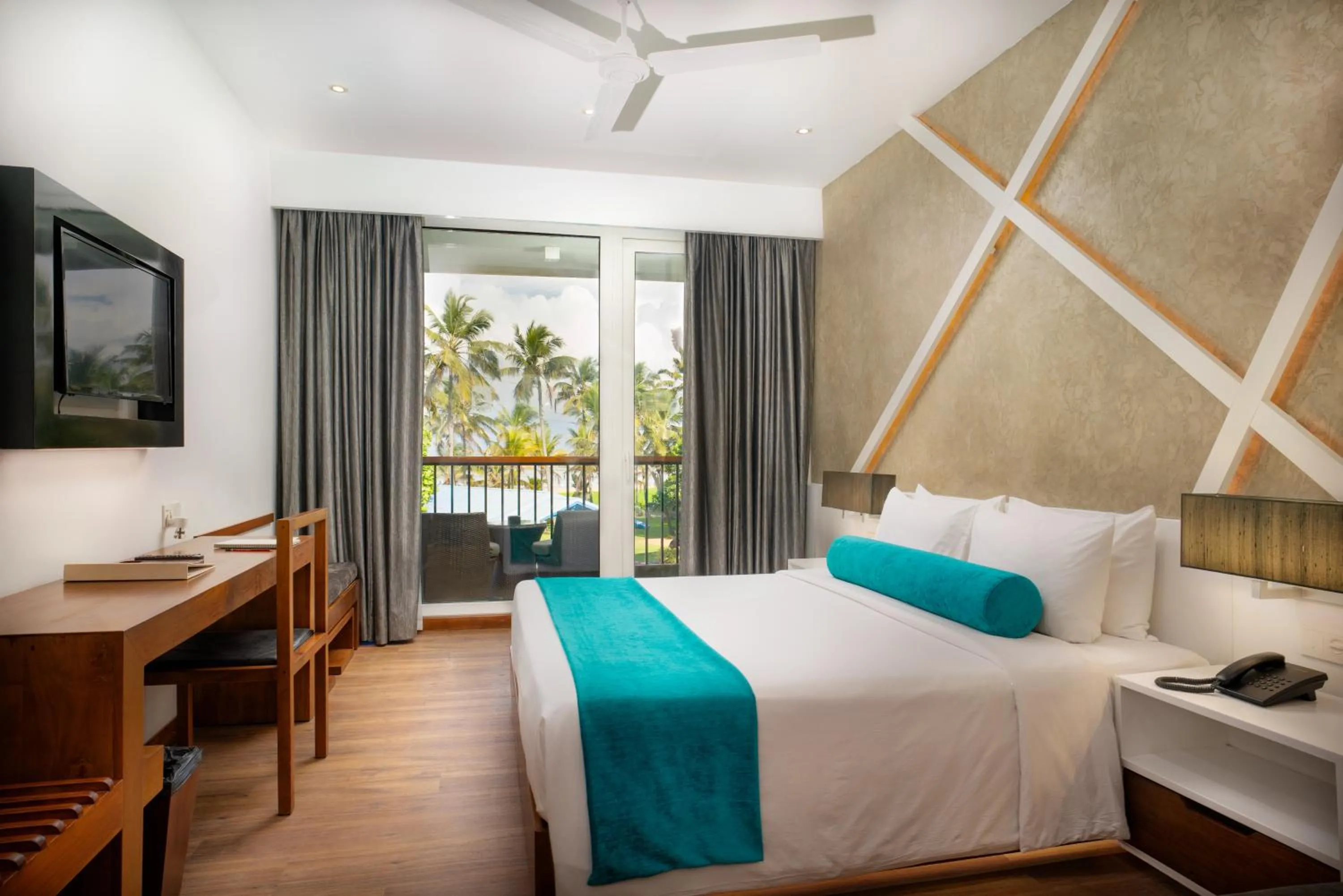 Bed in Camelot Beach Hotel