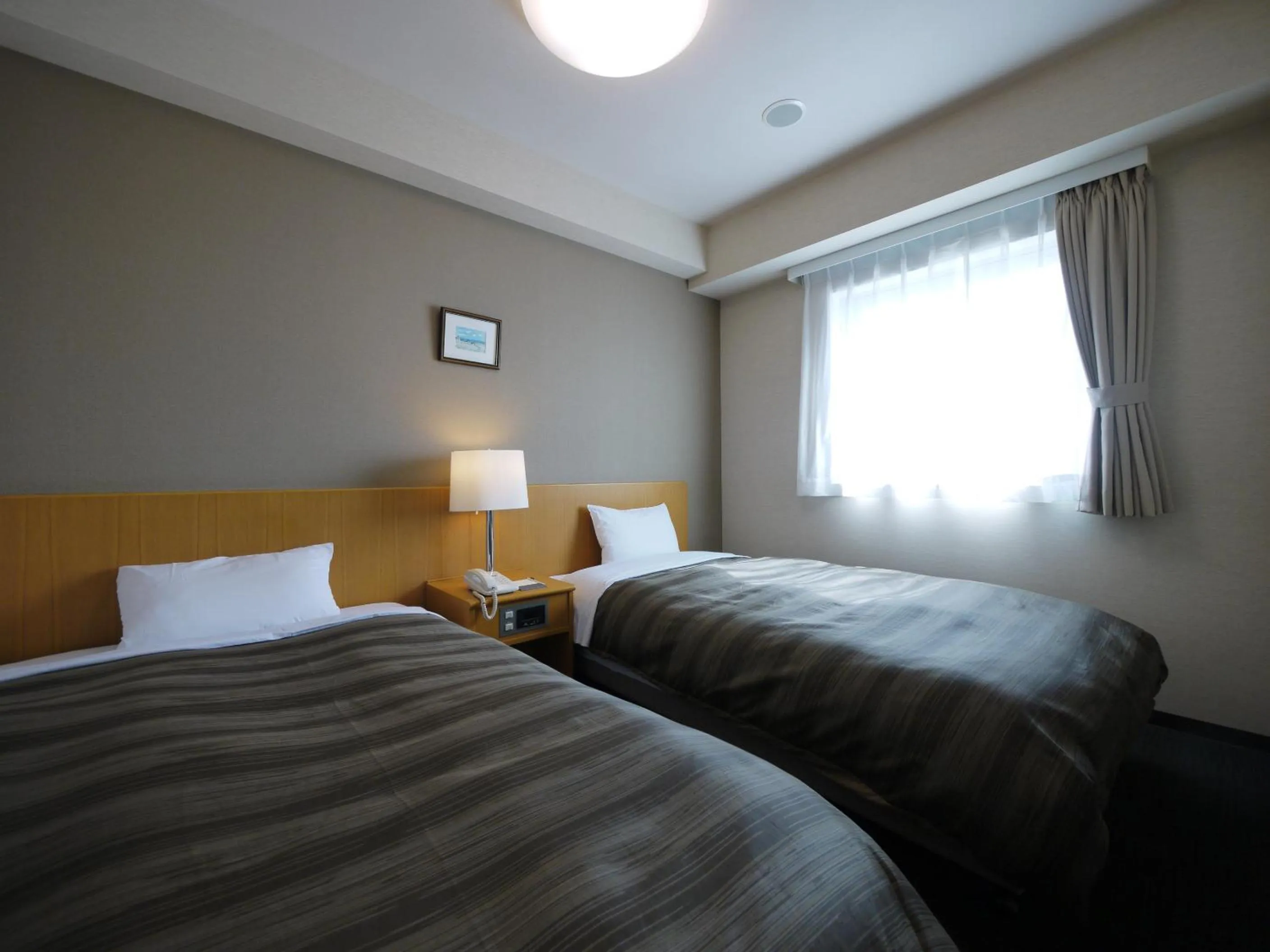 Photo of the whole room, Bed in Hotel Route-Inn Sapporo Shiroishi