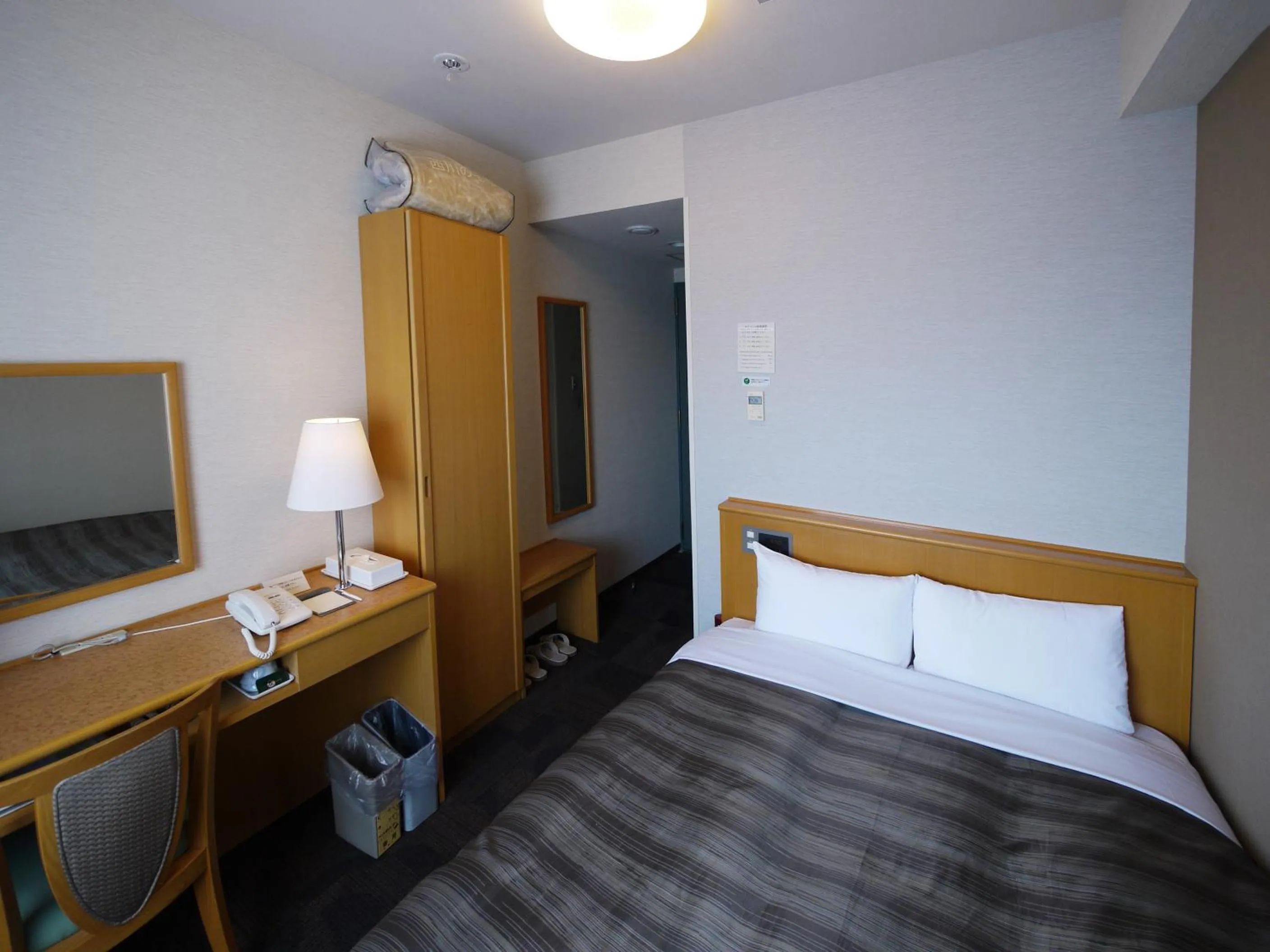 Photo of the whole room, Bed in Hotel Route-Inn Sapporo Shiroishi