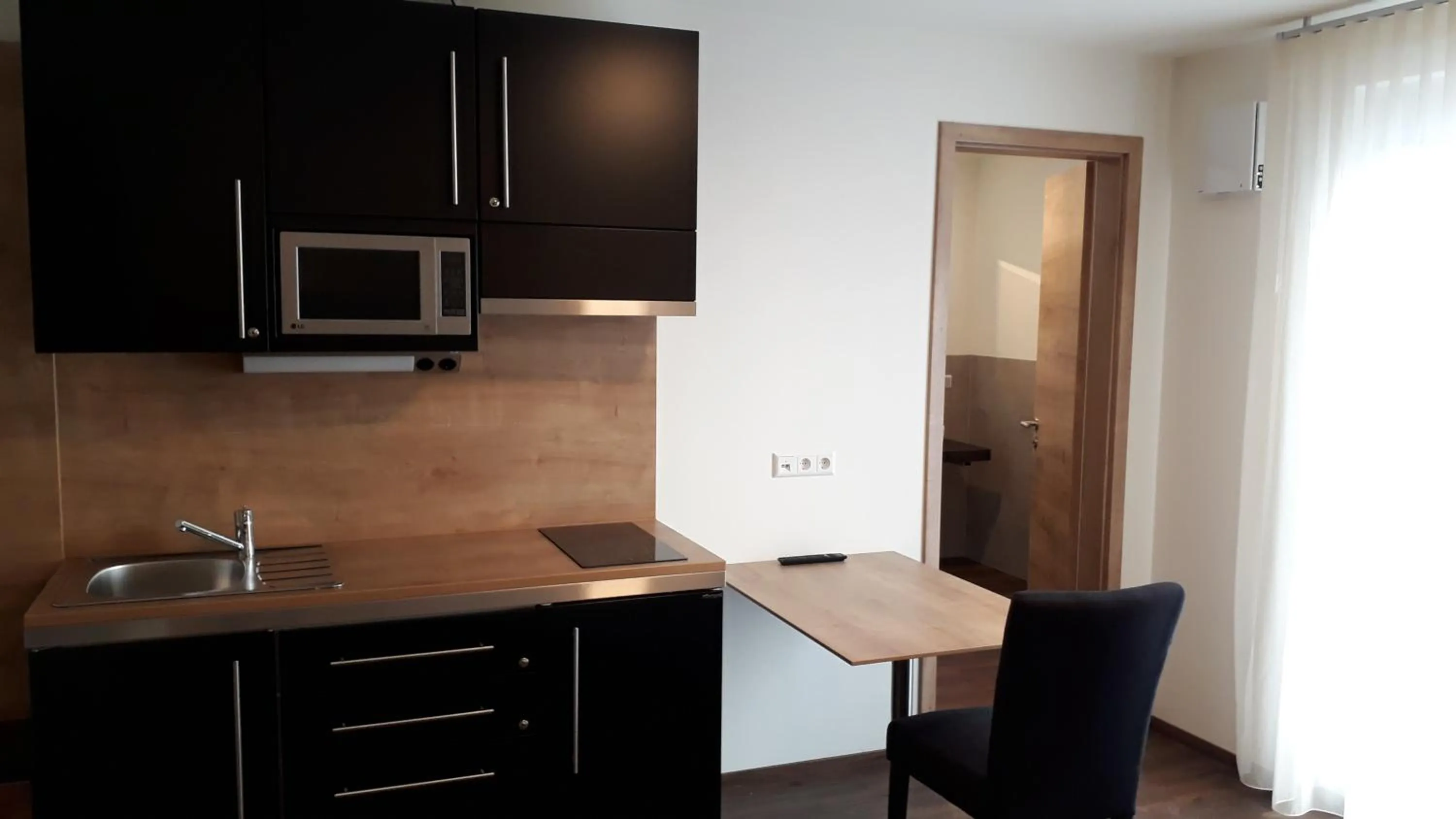 Kitchen or kitchenette in Waldhotel Rainau