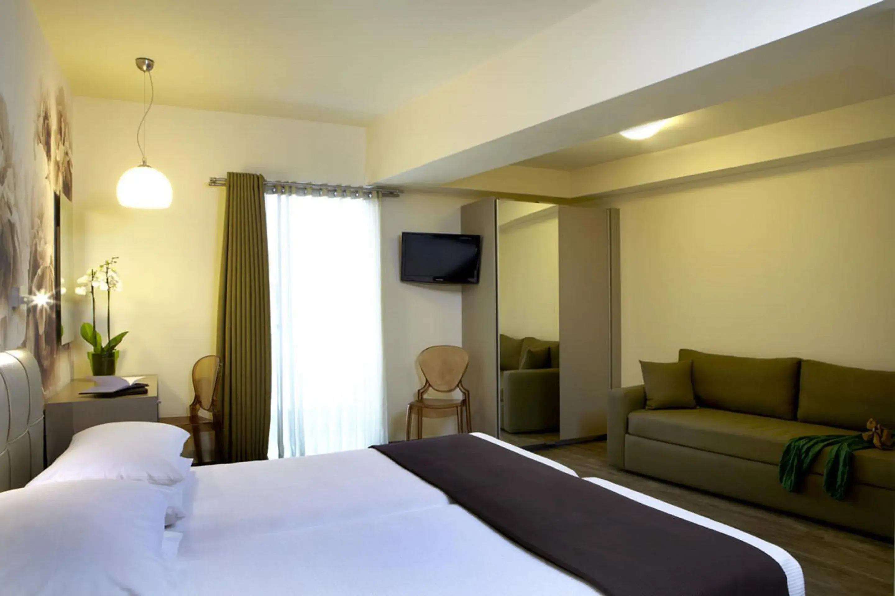 Family Room with Side Sea View in Mouikis Hotel Kefalonia Family Room with Side Sea View in Mouikis Hotel Kefalonia