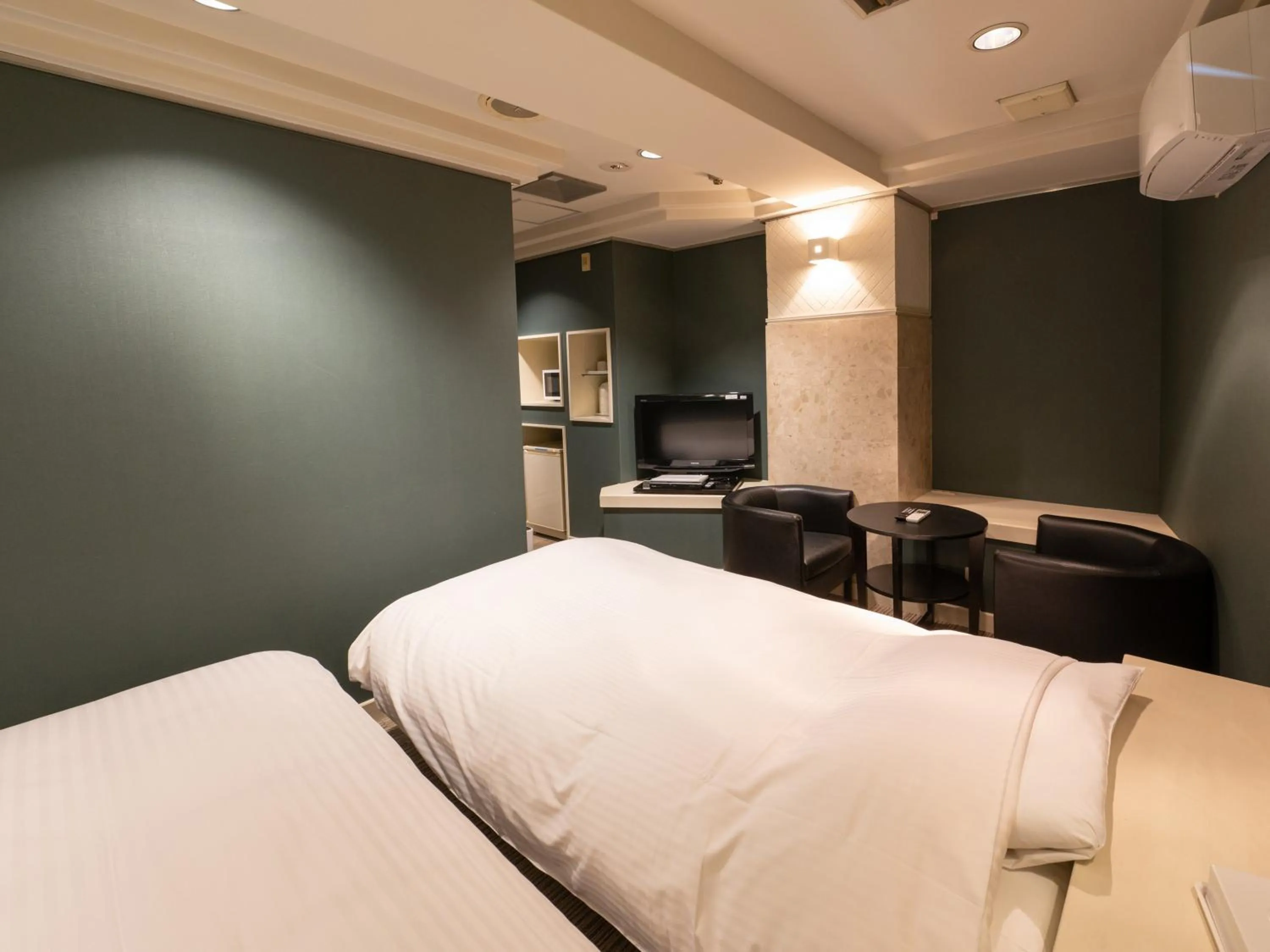 Bed in Tabist Hotel Rakuserina