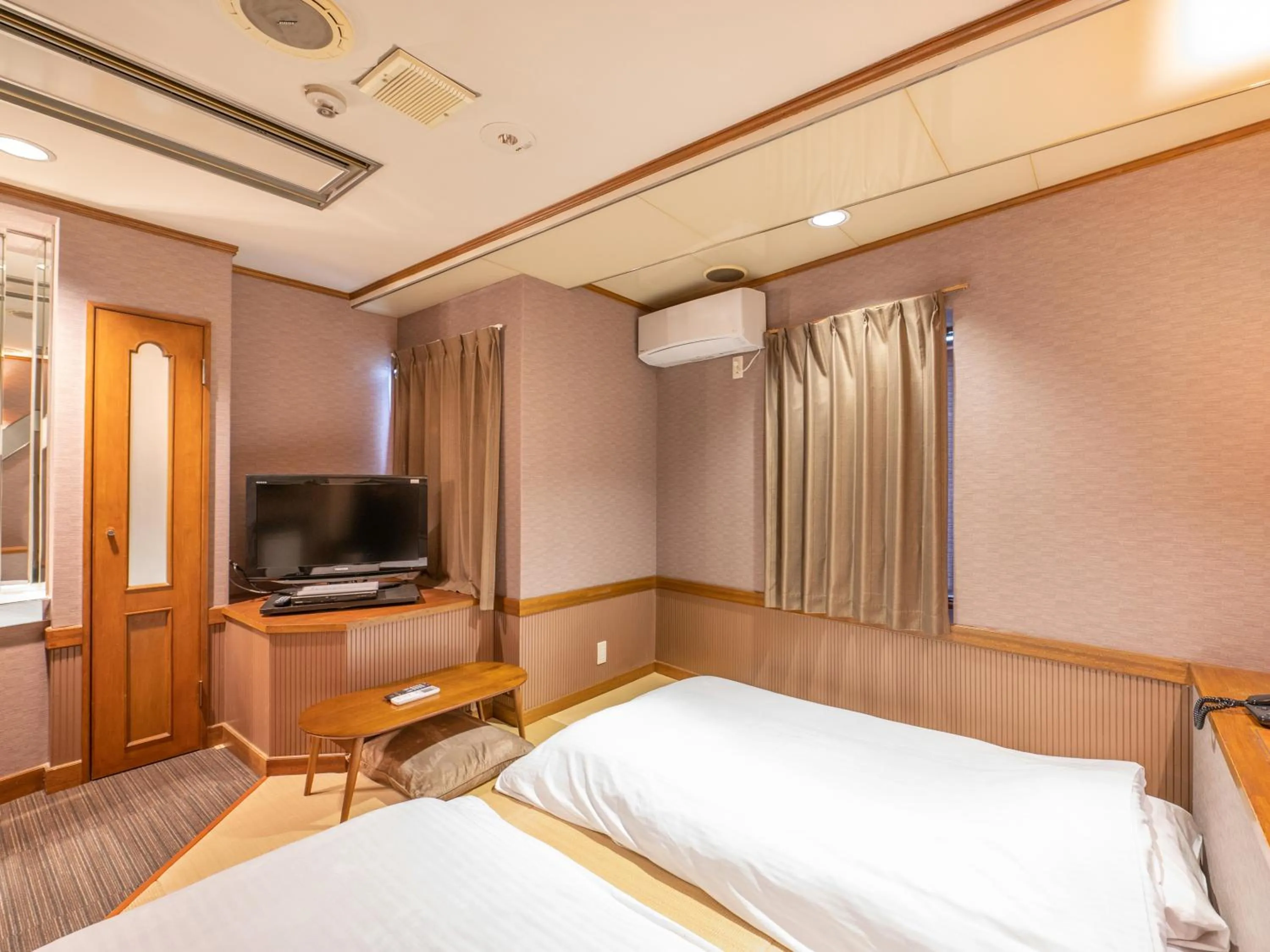 Bed in Tabist Hotel Rakuserina