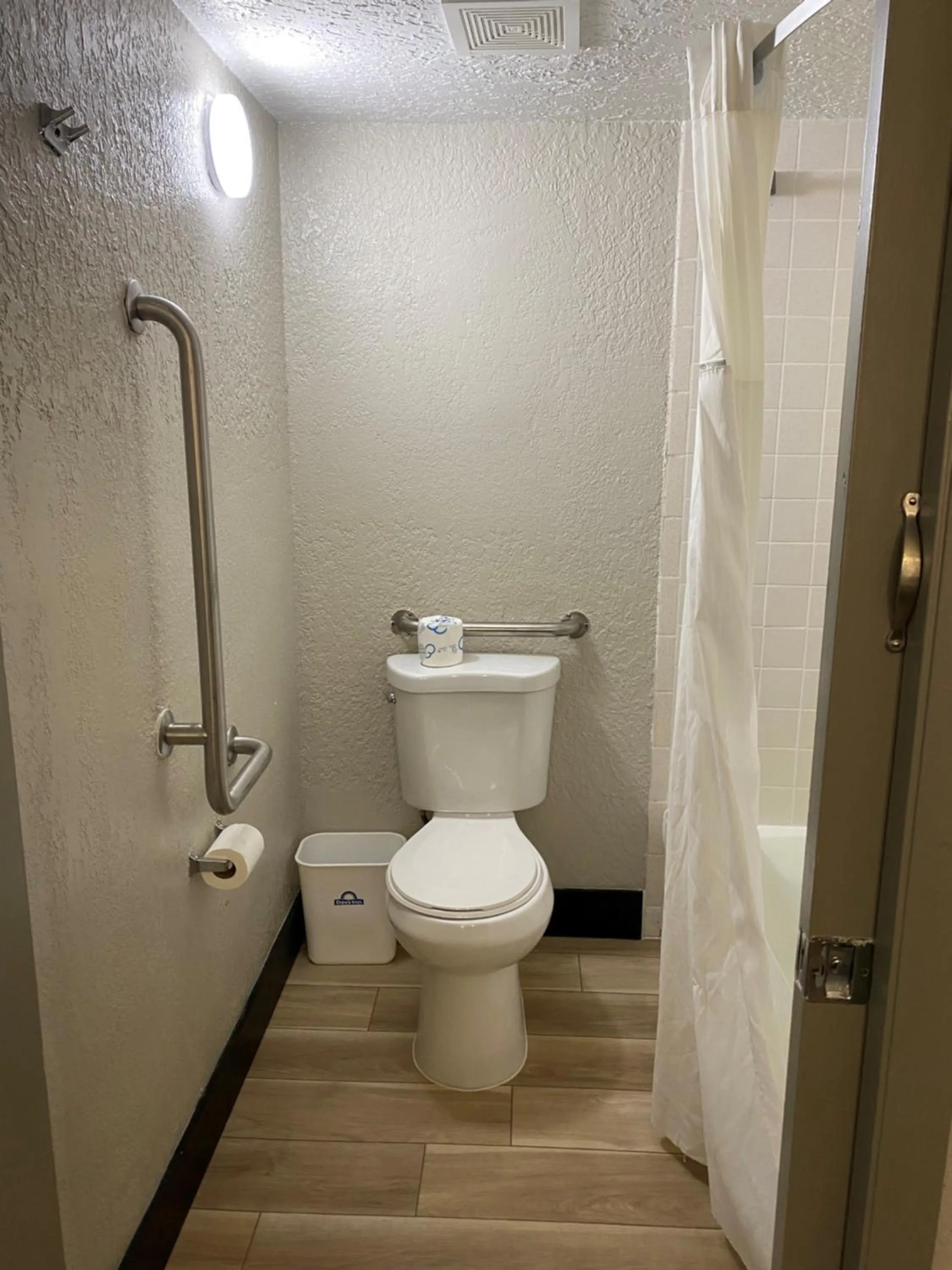 Toilet in Days Inn & Suites by Wyndham Fort Pierce Midtown