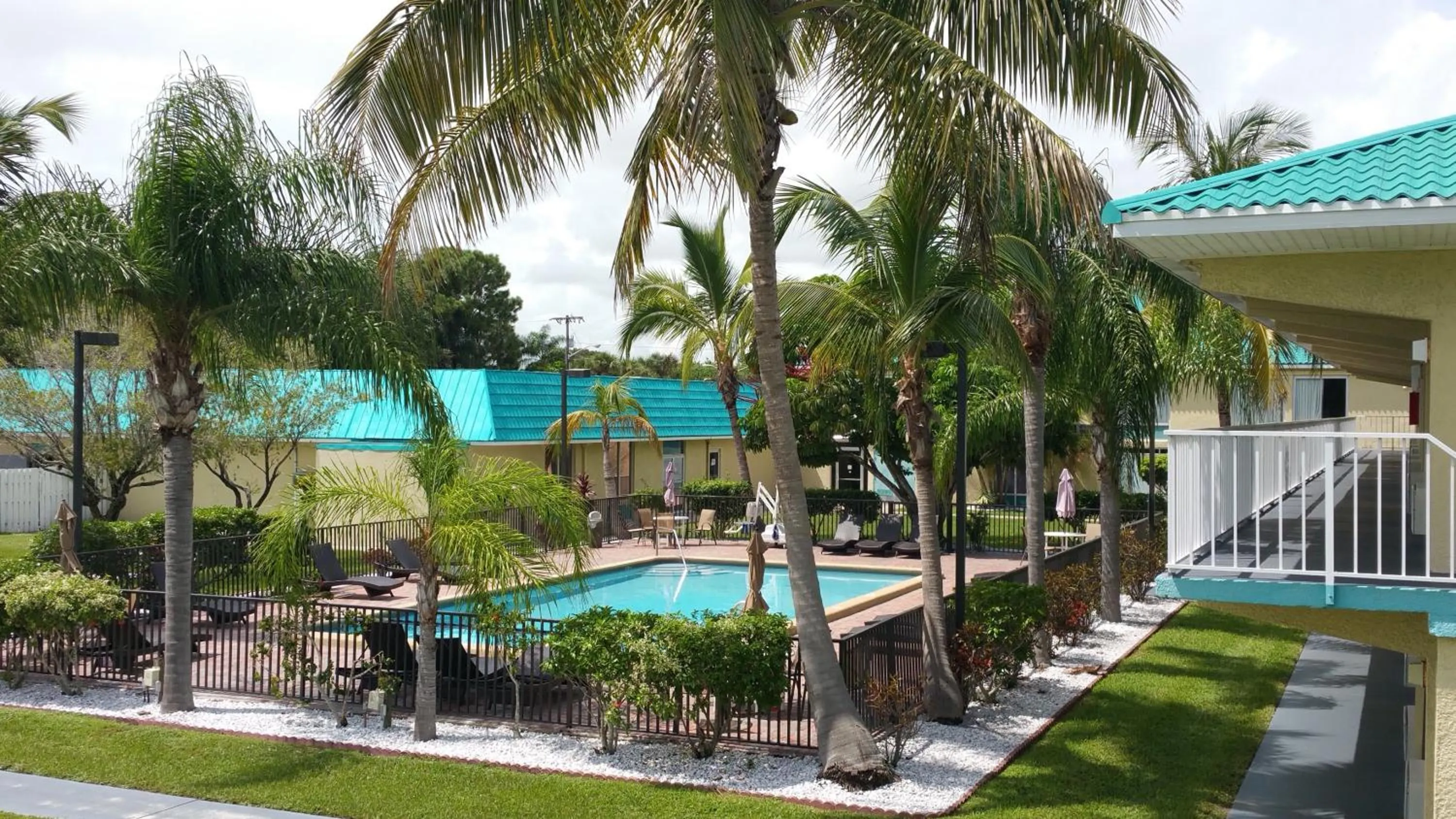 Swimming pool in Days Inn & Suites by Wyndham Fort Pierce Midtown