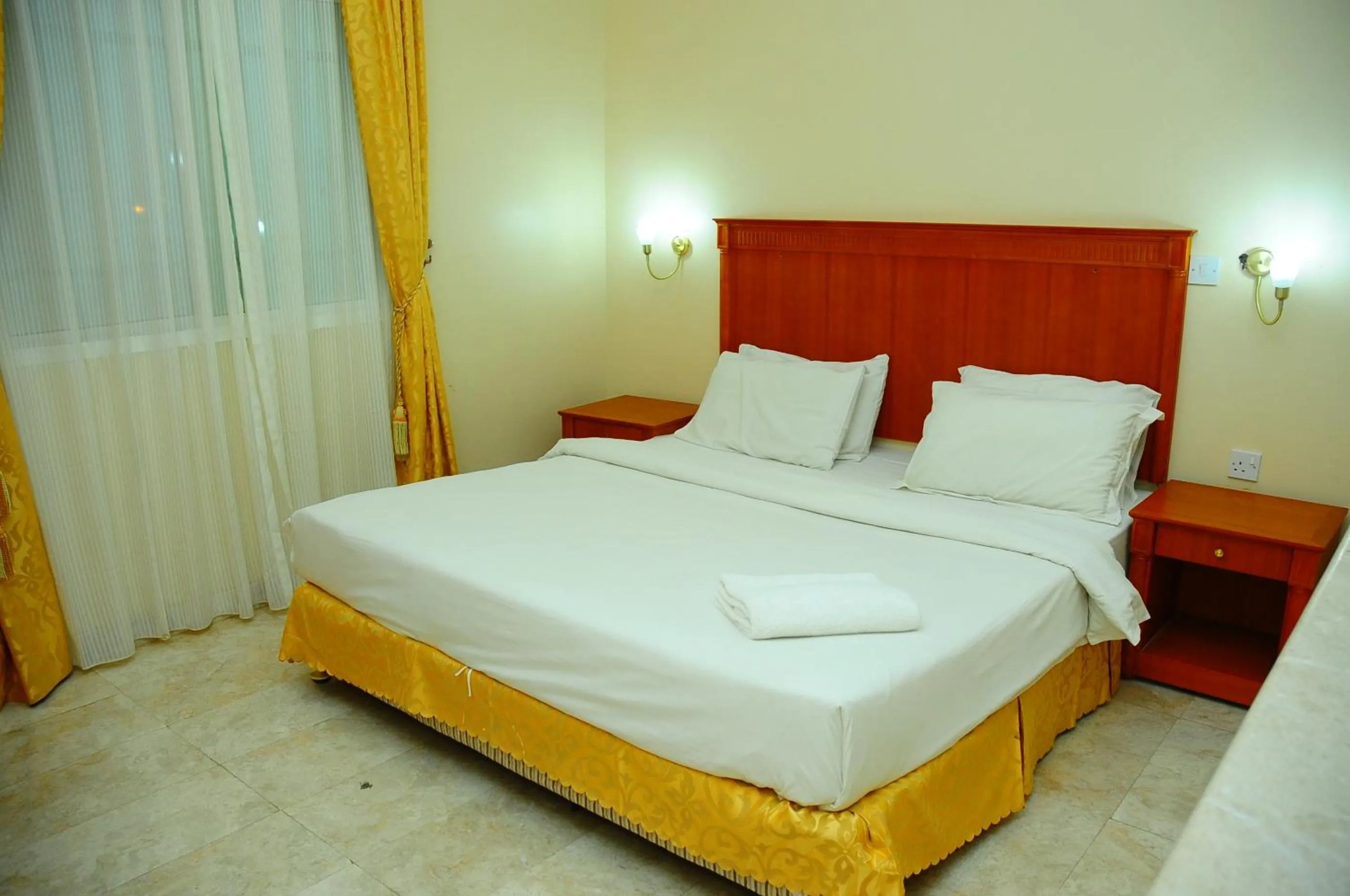 Bed in Al Faisal Hotel Suites