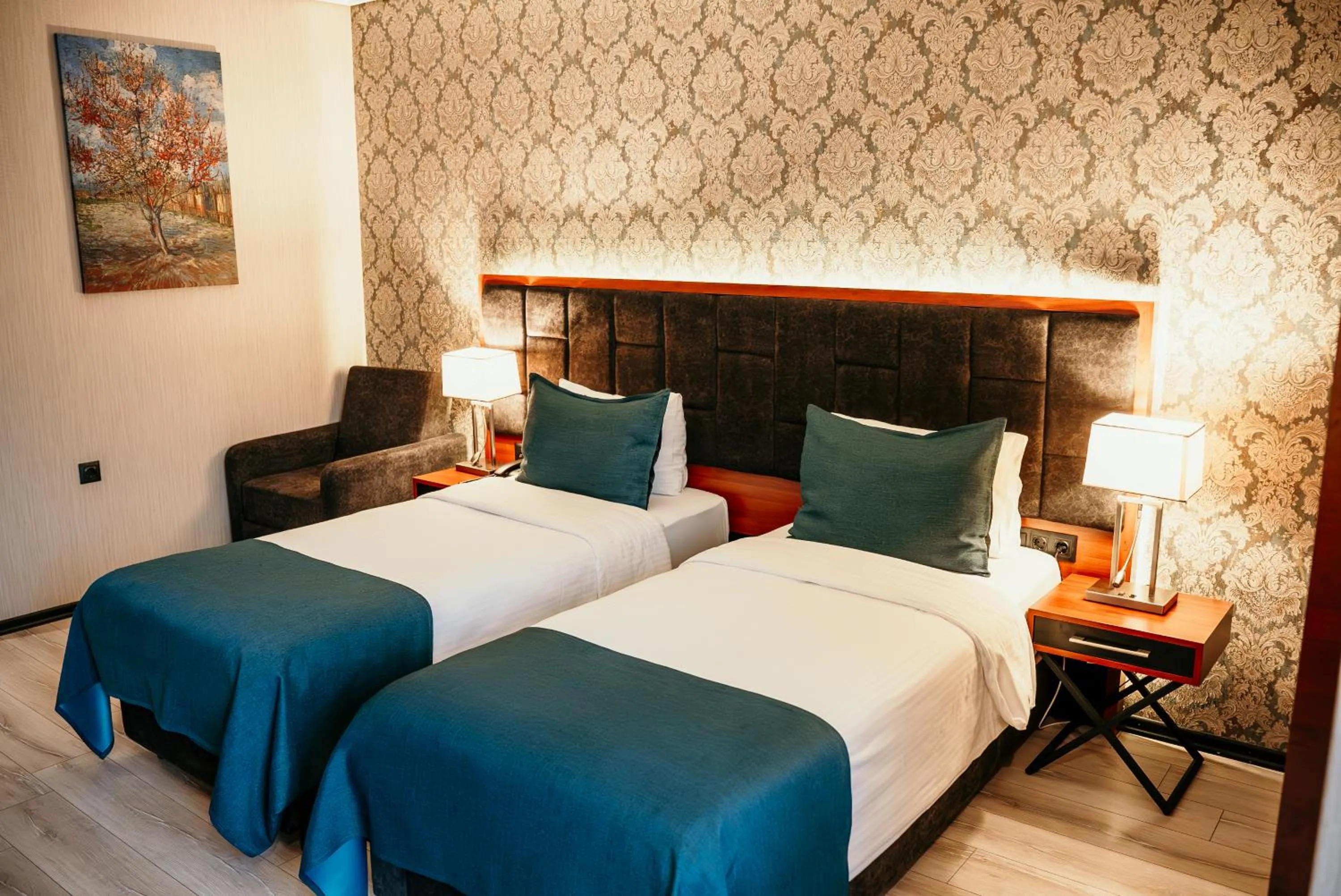 Bed in Grand Vaves Hotel