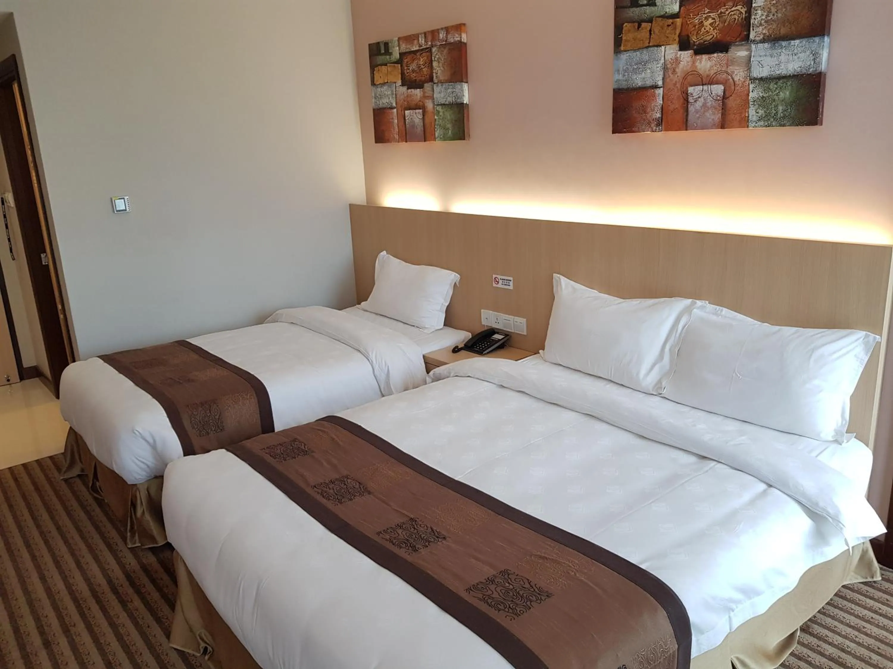 Bed in DeHome Boutique Hotel