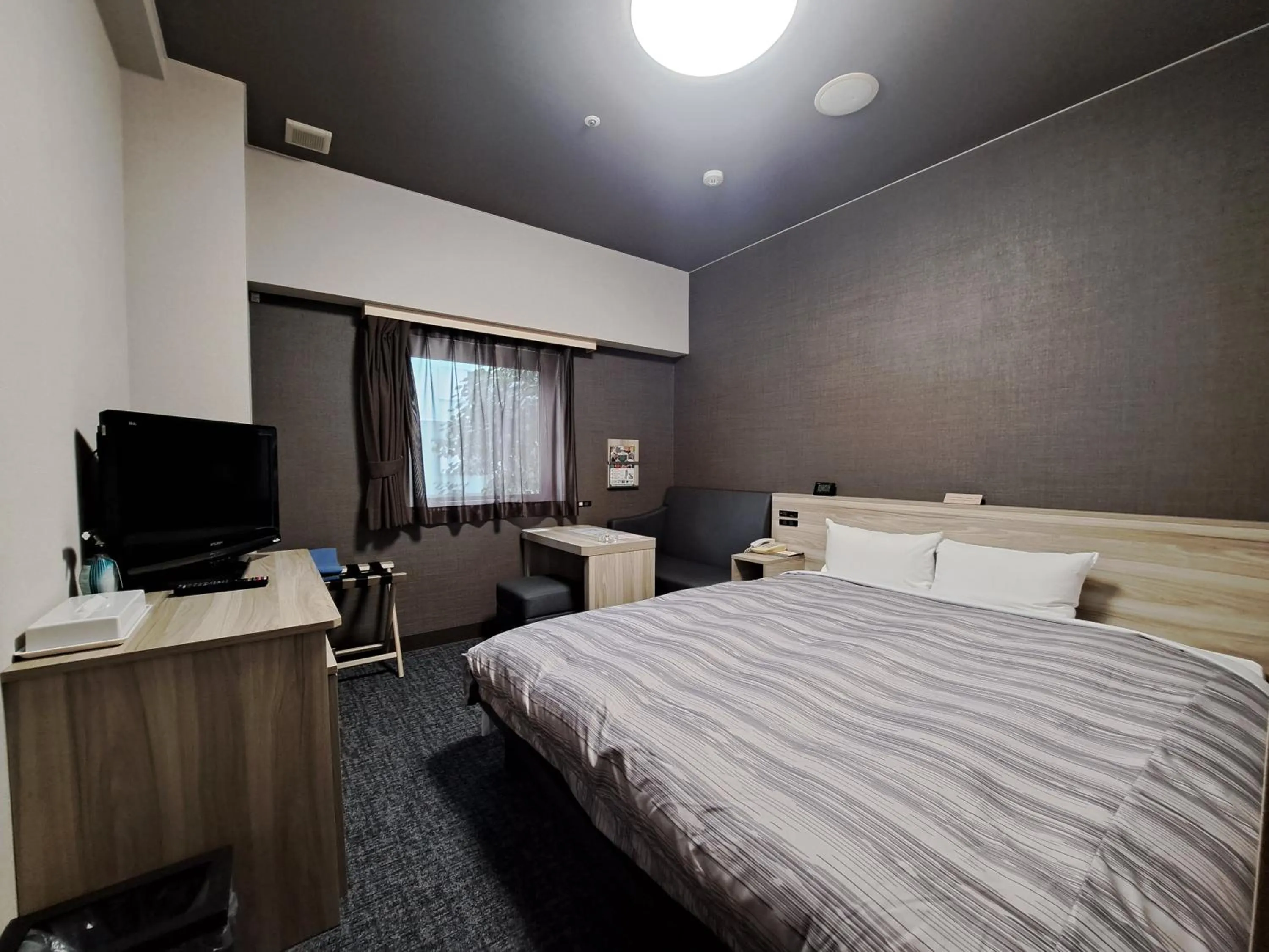 Bed in Route Inn Grantia Akita Spa Resort