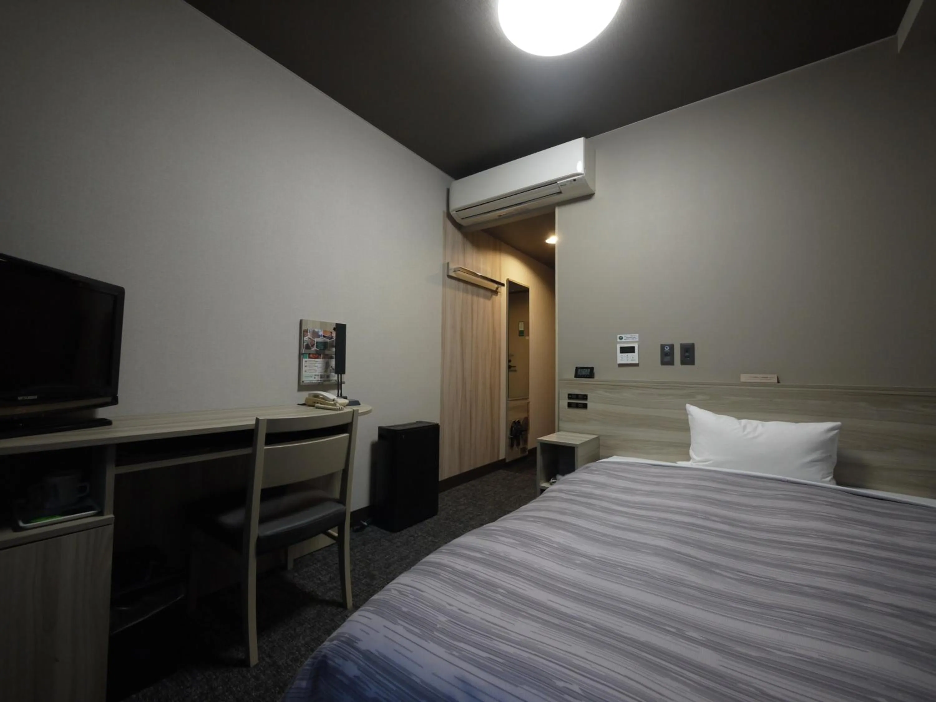 Bed in Route Inn Grantia Akita Spa Resort