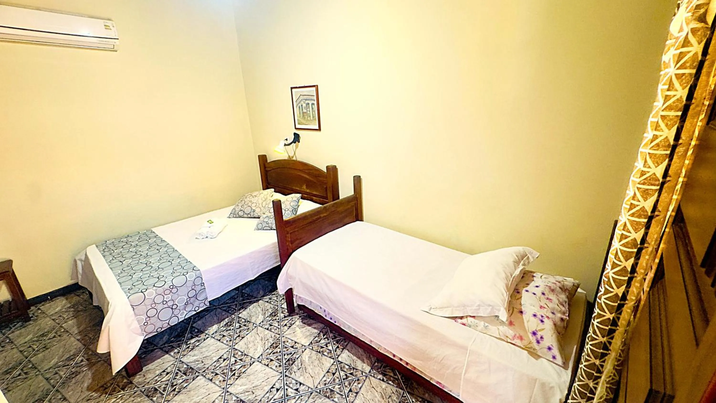 Bed in Pousada Parque Imperial no centro de Paraty