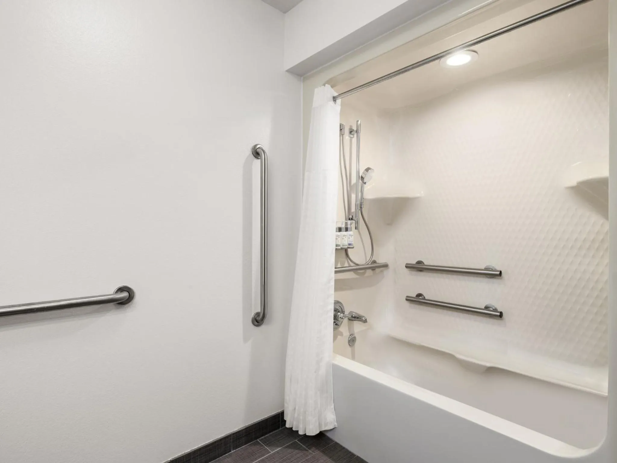 Bathroom in Garner Hotel Topeka West by IHG