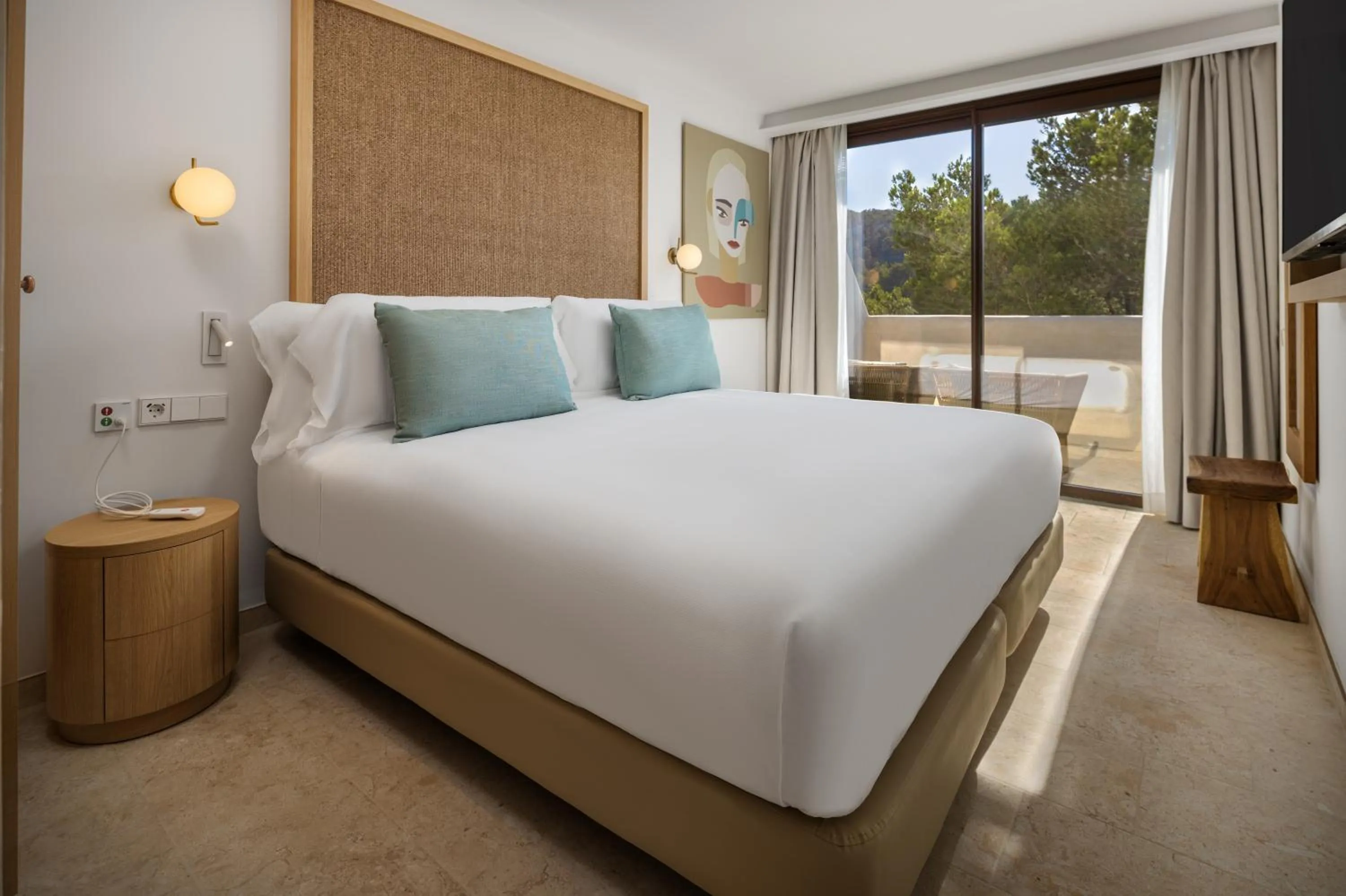 Bed in Cala San Miguel Ibiza Resort, Adults only, Curio Collection by Hilton