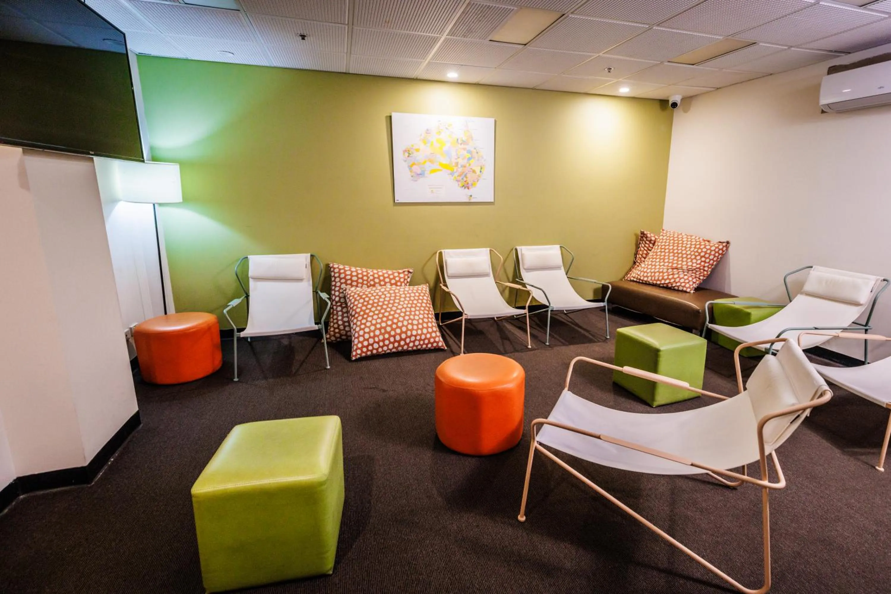 Communal lounge/ TV room in YHA Adelaide Central