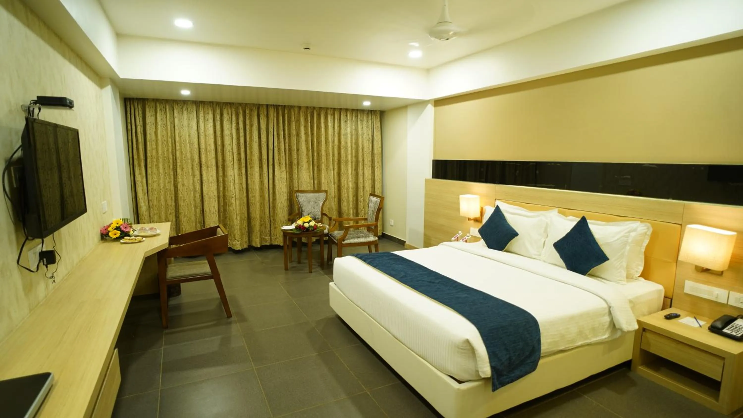 Photo of the whole room, Bed in Regenta Central Somnath, Bhalpara
