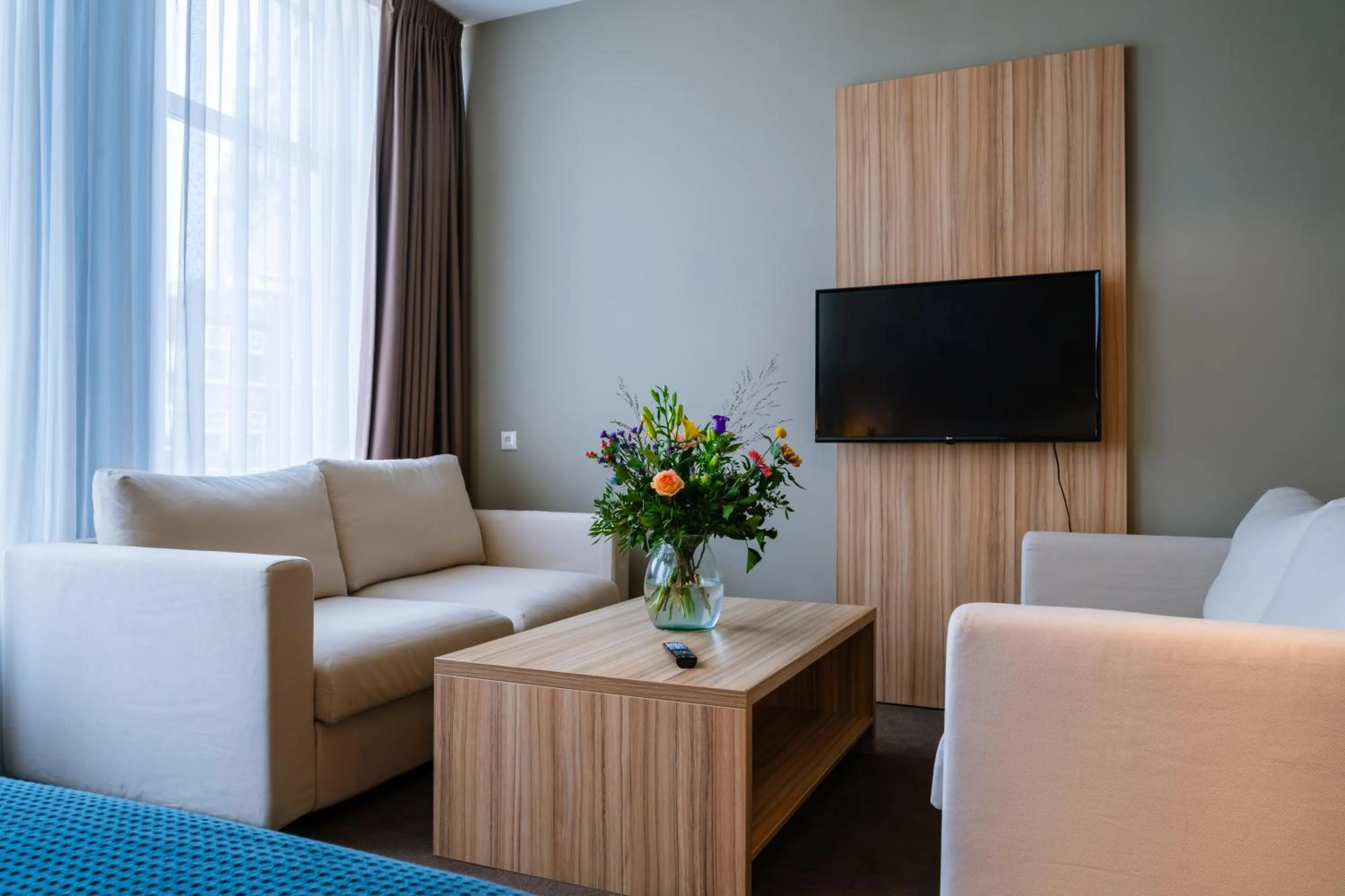 Communal lounge/ TV room in Stadshotel De Klok