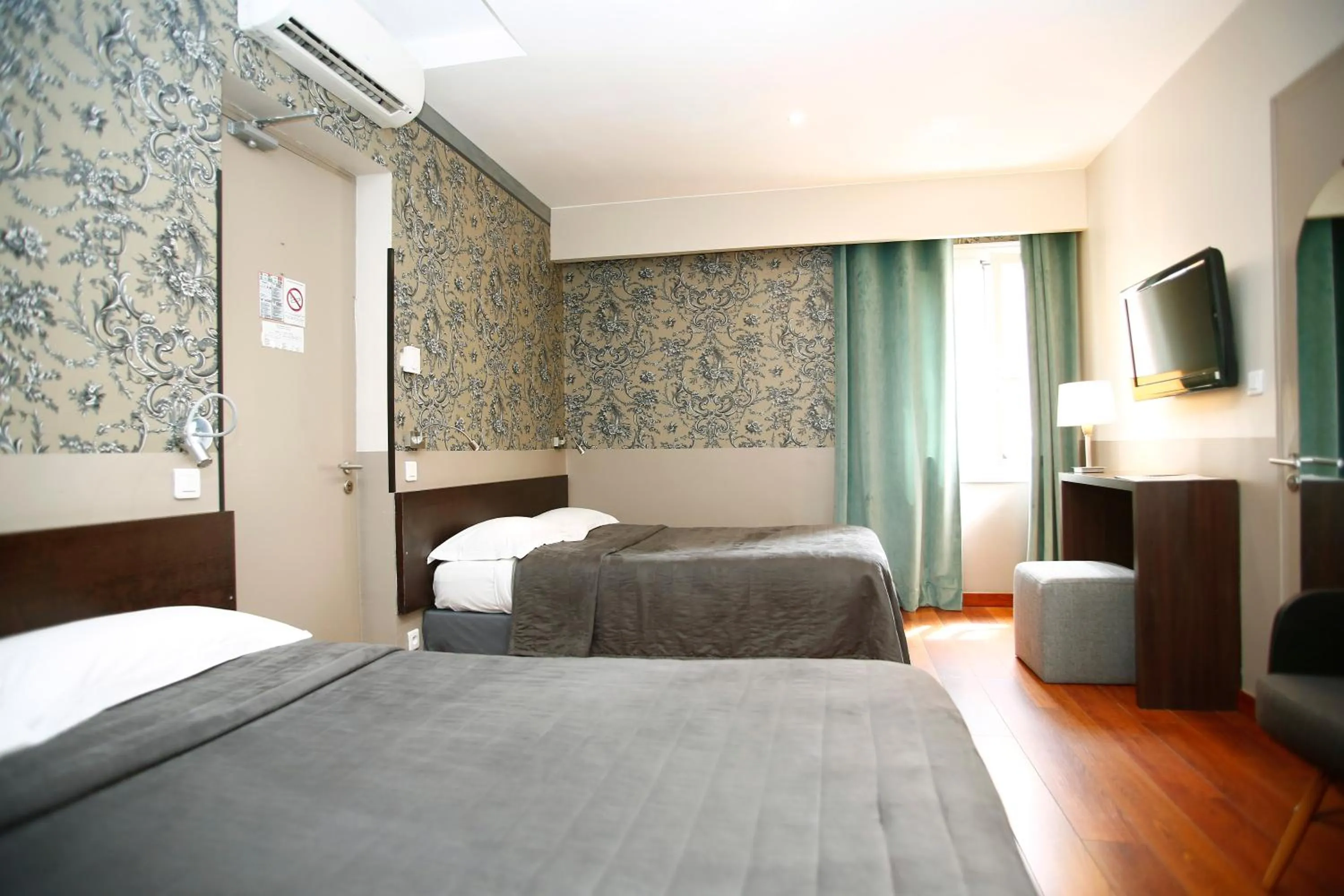 Bed in Hotel Restaurant Christophe Colomb