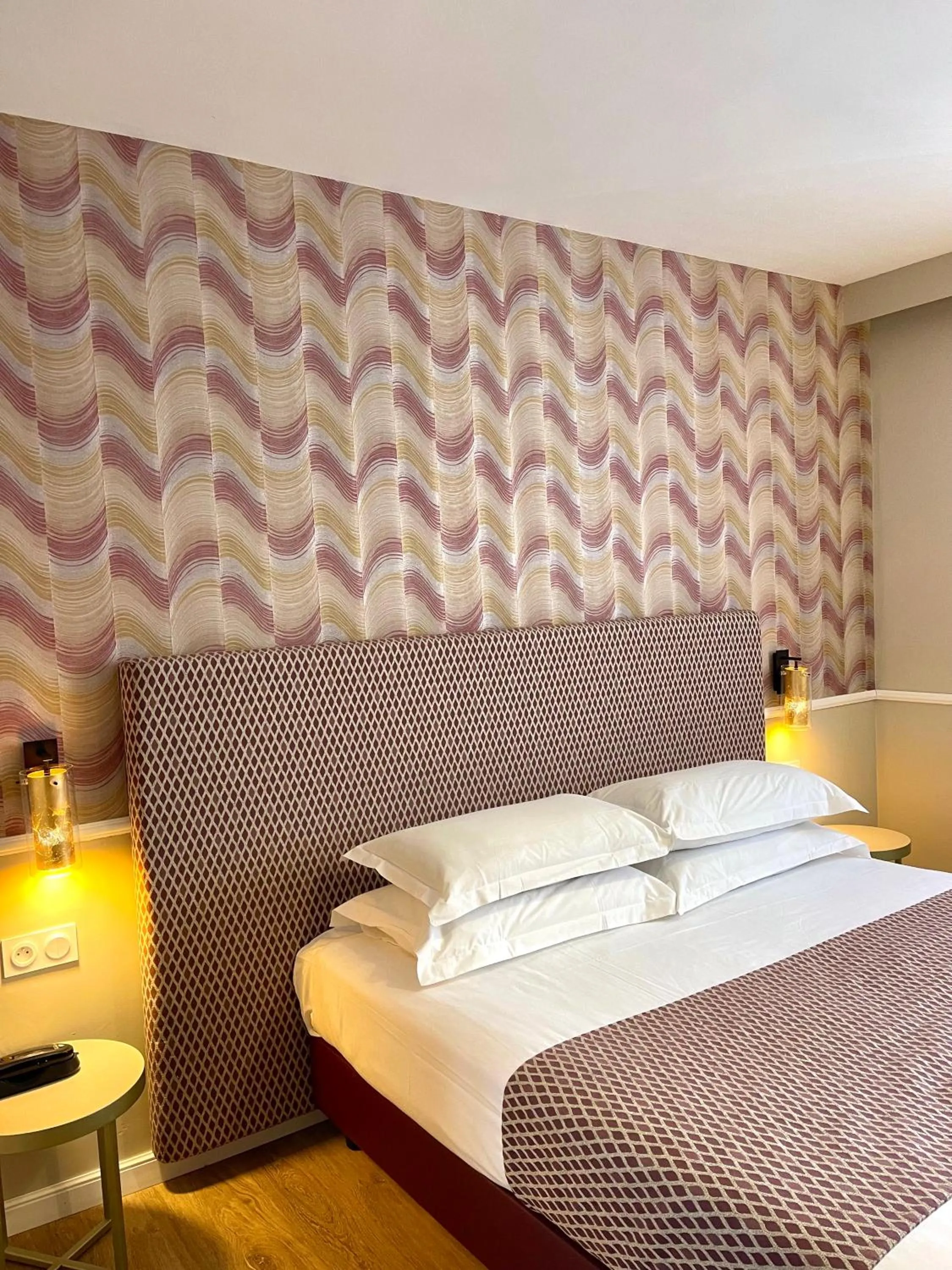 Decorative detail, Bed in Hotel Restaurant Christophe Colomb