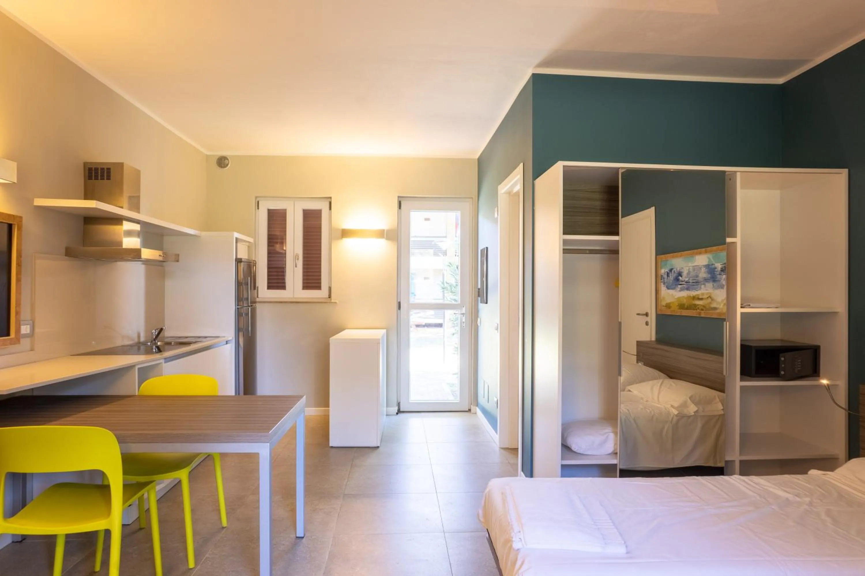 Bed in Golfo del Sole Hotel & Holiday Resort