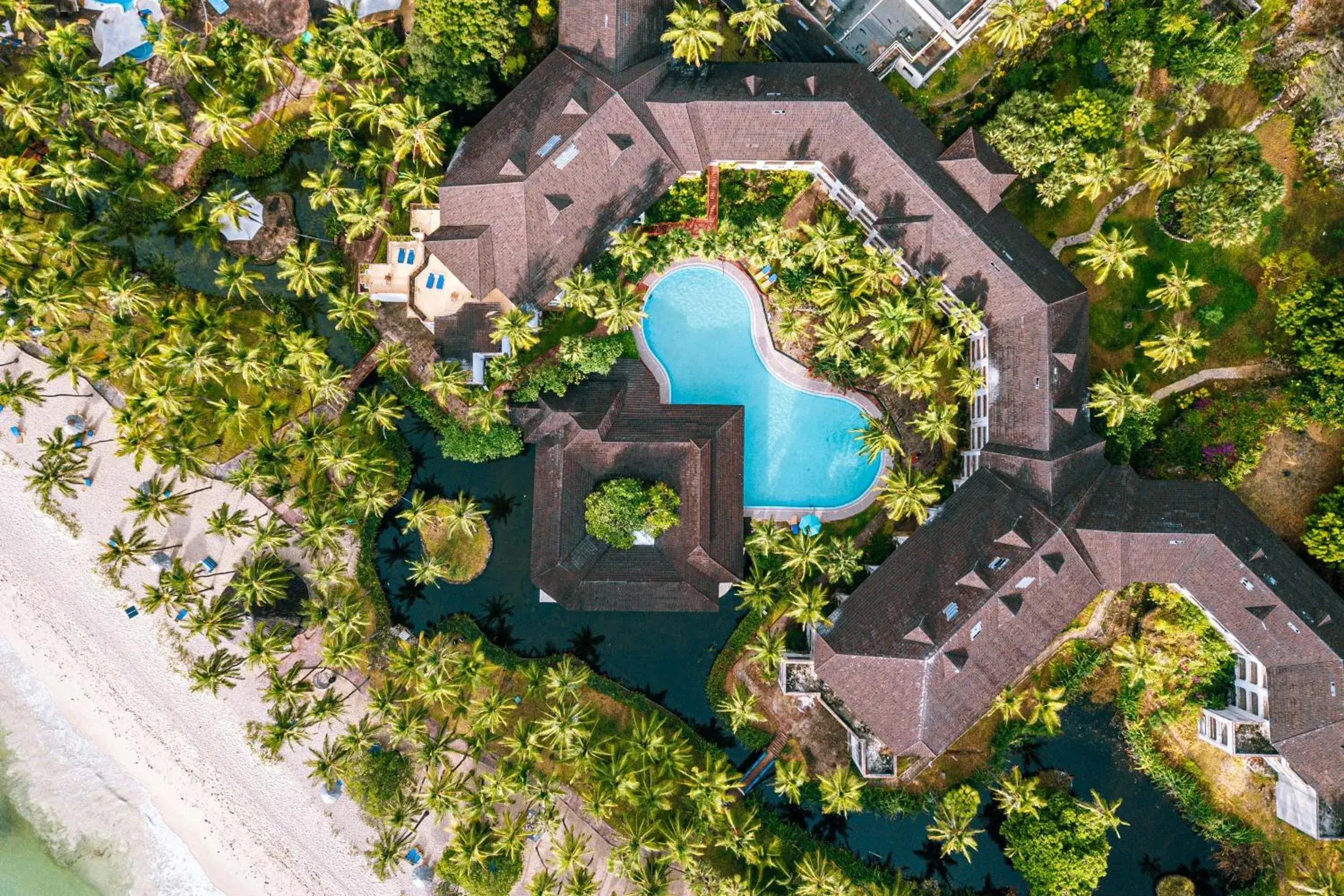 Swimming pool in Diani Reef Beach Resort & Spa - Your Beachfront Bliss Awaits Swimming pool in Diani Reef Beach Resort & Spa - Your Beachfront Bliss Awaits