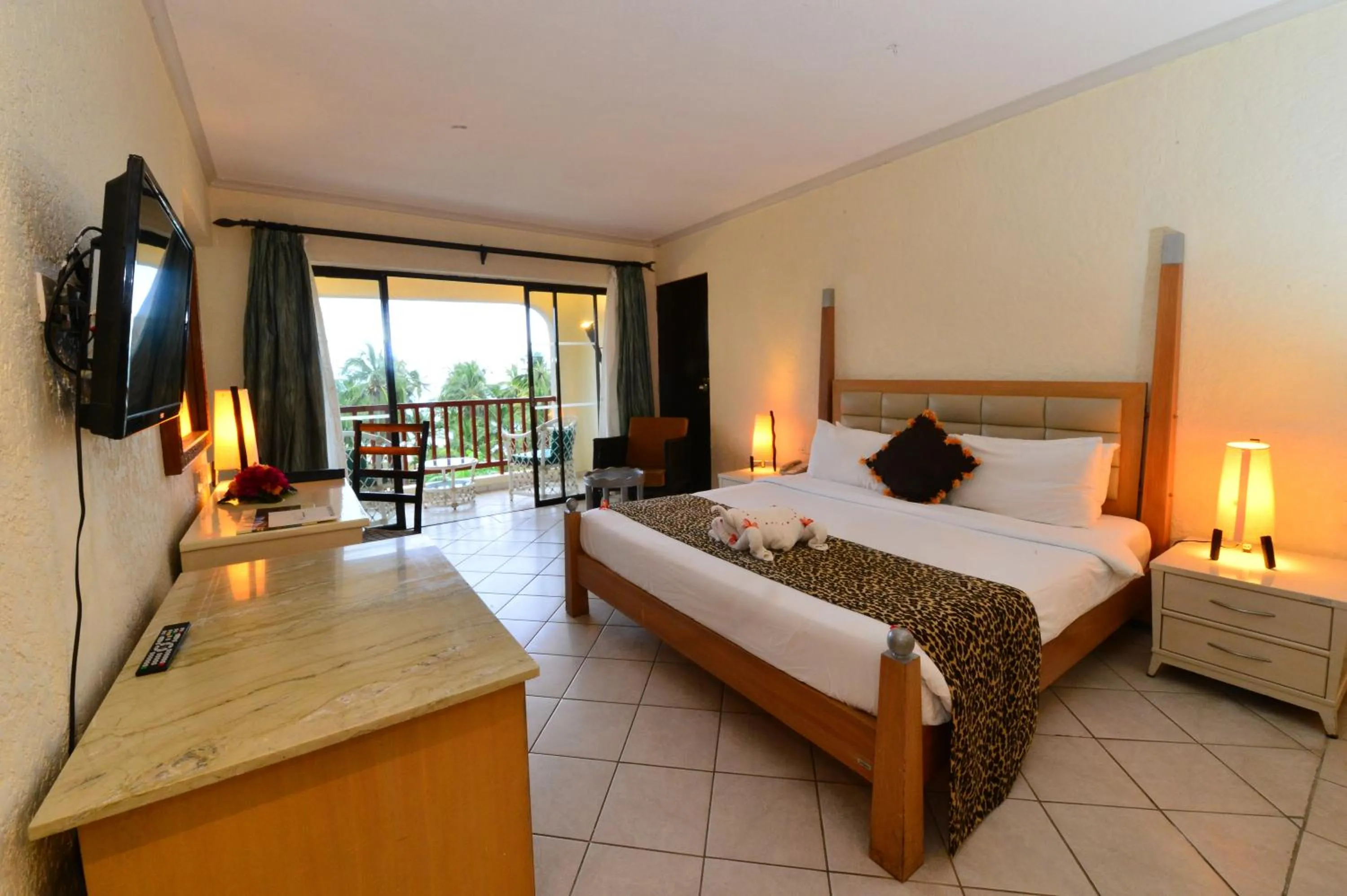 Bedroom, Bed in Diani Reef Beach Resort & Spa - Your Beachfront Bliss Awaits