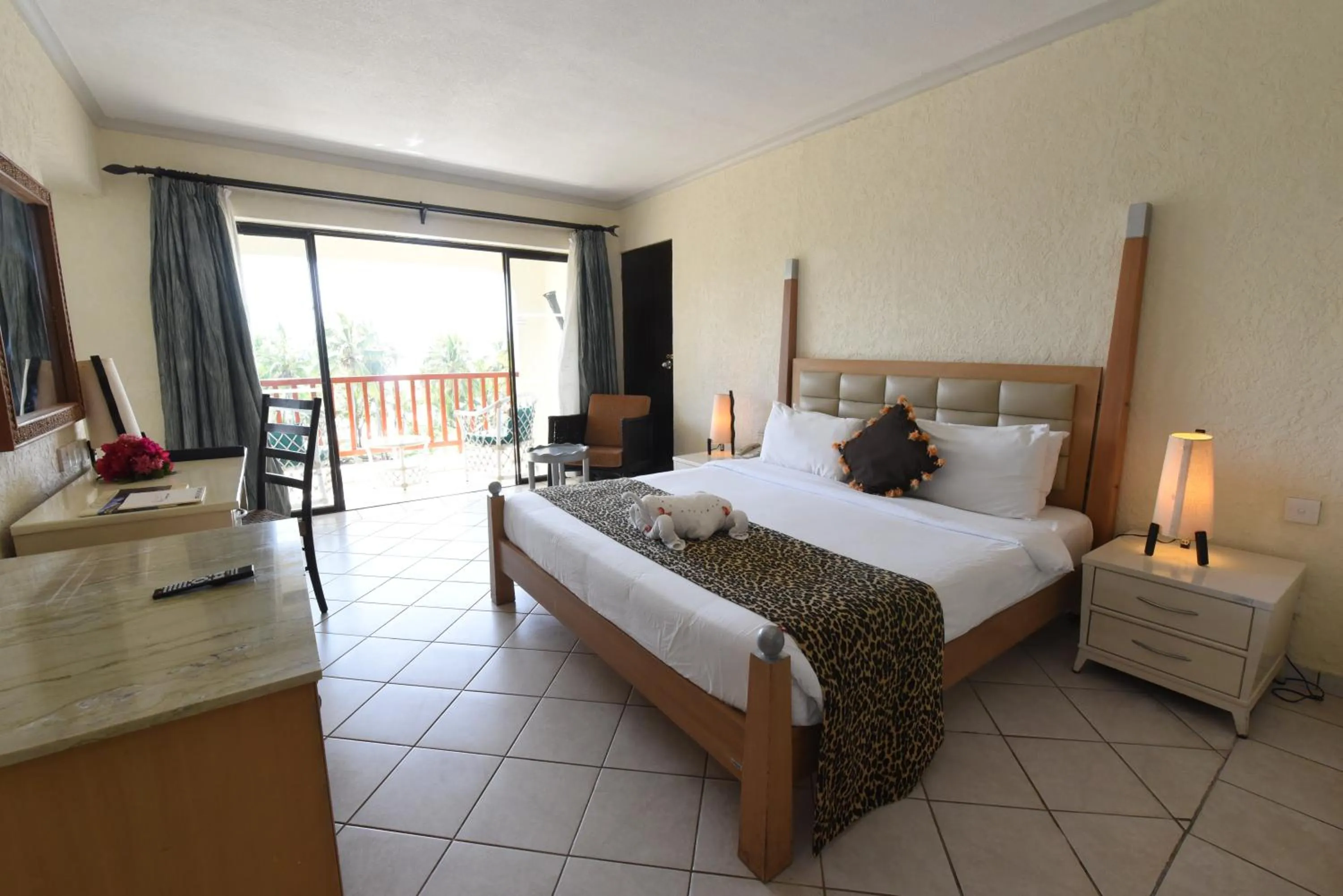 Bedroom, Bed in Diani Reef Beach Resort & Spa - Your Beachfront Bliss Awaits