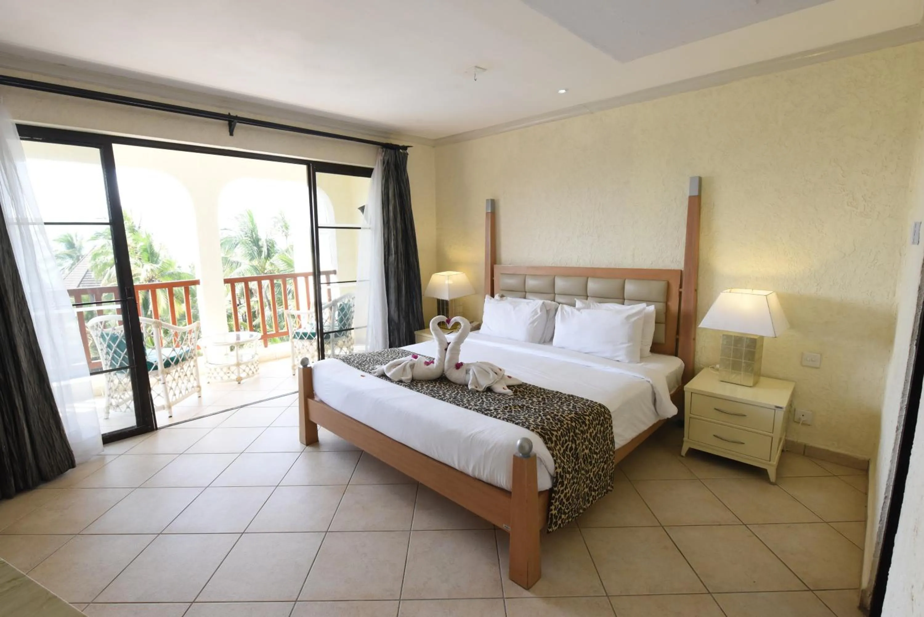 Bedroom, Bed in Diani Reef Beach Resort & Spa - Your Beachfront Bliss Awaits