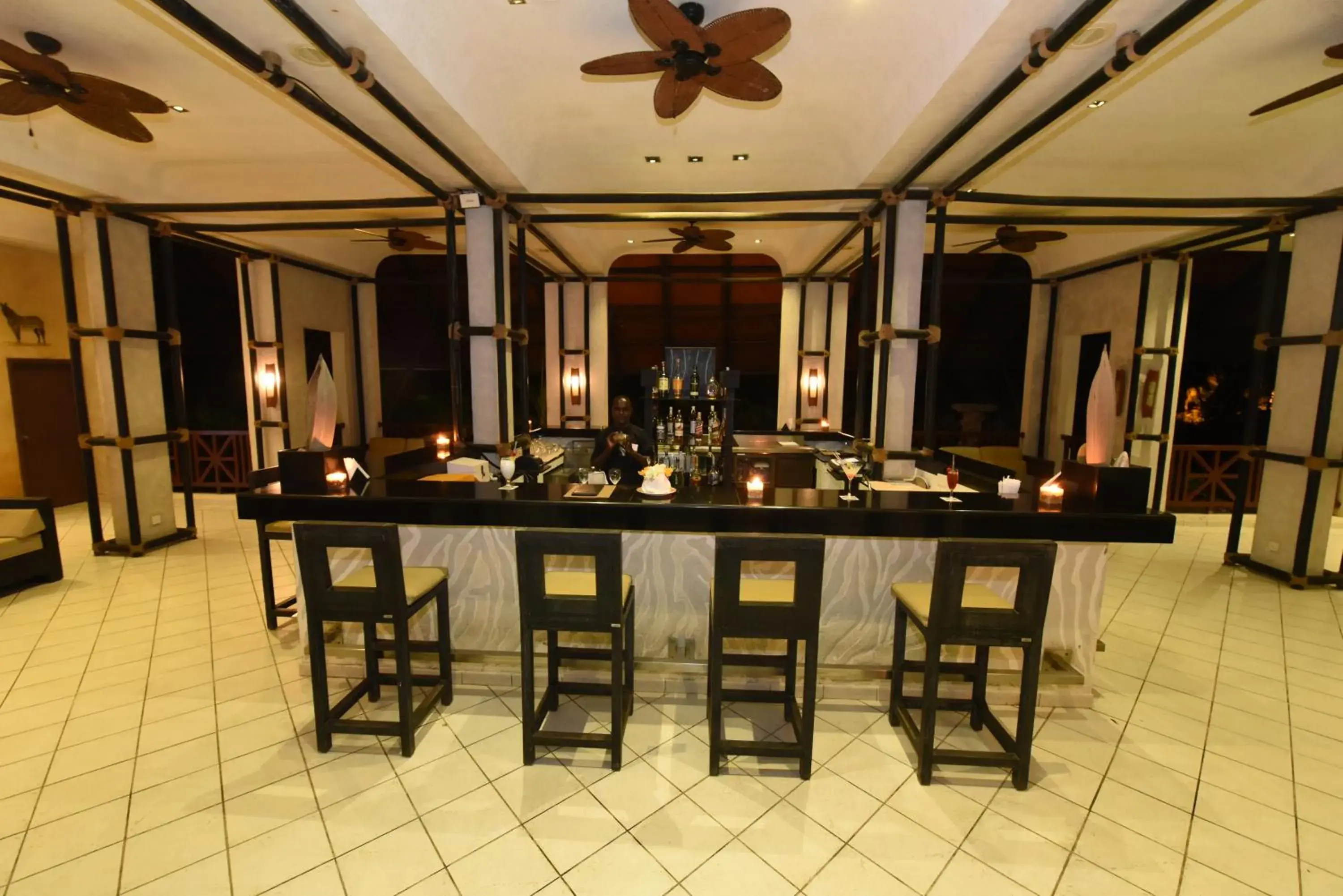 Lounge or bar in Diani Reef Beach Resort & Spa - Your Beachfront Bliss Awaits Lounge or bar in Diani Reef Beach Resort & Spa - Your Beachfront Bliss Awaits