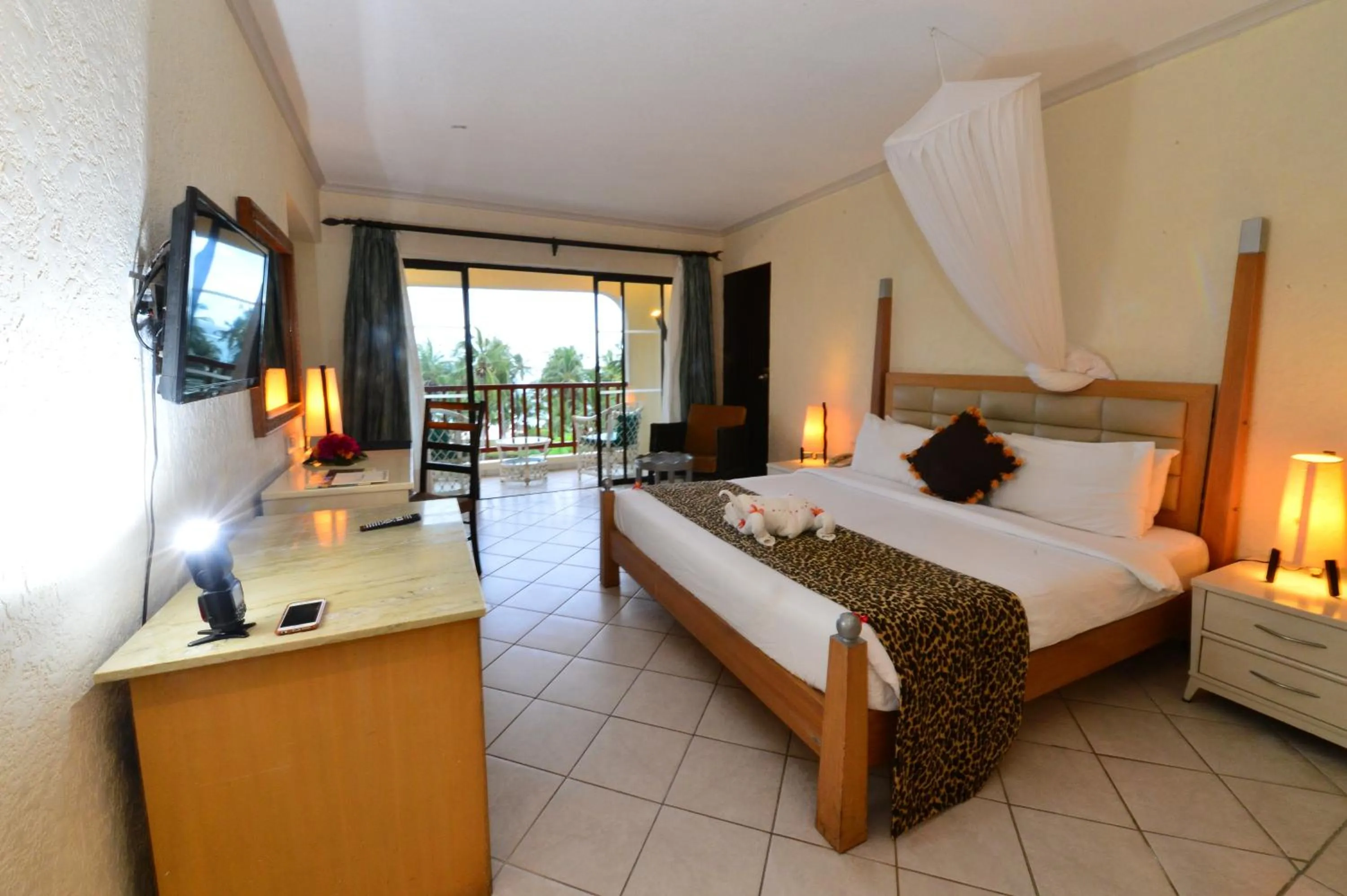 Bedroom, Bed in Diani Reef Beach Resort & Spa - Your Beachfront Bliss Awaits
